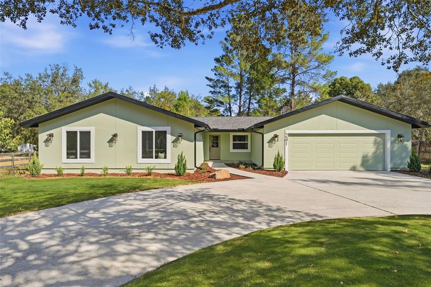 Home for the Holidays! Welcome to your new home—freshly renovated inside and out with beautiful interiors curated by a professional designer. This home blends modern comfort with peaceful natural surroundings, offering the perfect retreat while still being close to everything Chuluota, Oviedo, and East Seminole County have to offer.  Situated on three-quarters of an acre, this property provides exceptional privacy, outdoor space, and future potential. The open great room floor plan is ideal for entertaining, with a seamless flow to an oversized rear deck and an additional screened patio—perfect for outdoor gatherings, morning coffee, or weekend relaxation.  To the rear of the property, you’ll enjoy plenty of room to roam and a true connection to nature. Follow the pathway at the back of the lot and you’ll discover access to a small canal connected to a nearby lake, offering a unique outdoor experience and showcasing Florida’s natural beauty.  Inside, every finish has been thoughtfully selected to create a home that feels like a brand-new custom build. Whether you're hosting friends or enjoying quiet evenings at home, the layout and designer-selected features make everyday living effortless.  Located within the highly sought-after Seminole County school district, this home provides an unbeatable lifestyle just minutes from local parks, hiking trails, conservation areas, shopping, and dining. Enjoy the charm of Chuluota while benefiting from convenient access to Oviedo, Winter Springs, and the 417 for easy commuting.  This move-in-ready home delivers the perfect combination of style, land, and location, and is available for a quick closing. Don’t miss this rare opportunity to purchase your new home on acreage in one of Central Florida’s most desirable areas.