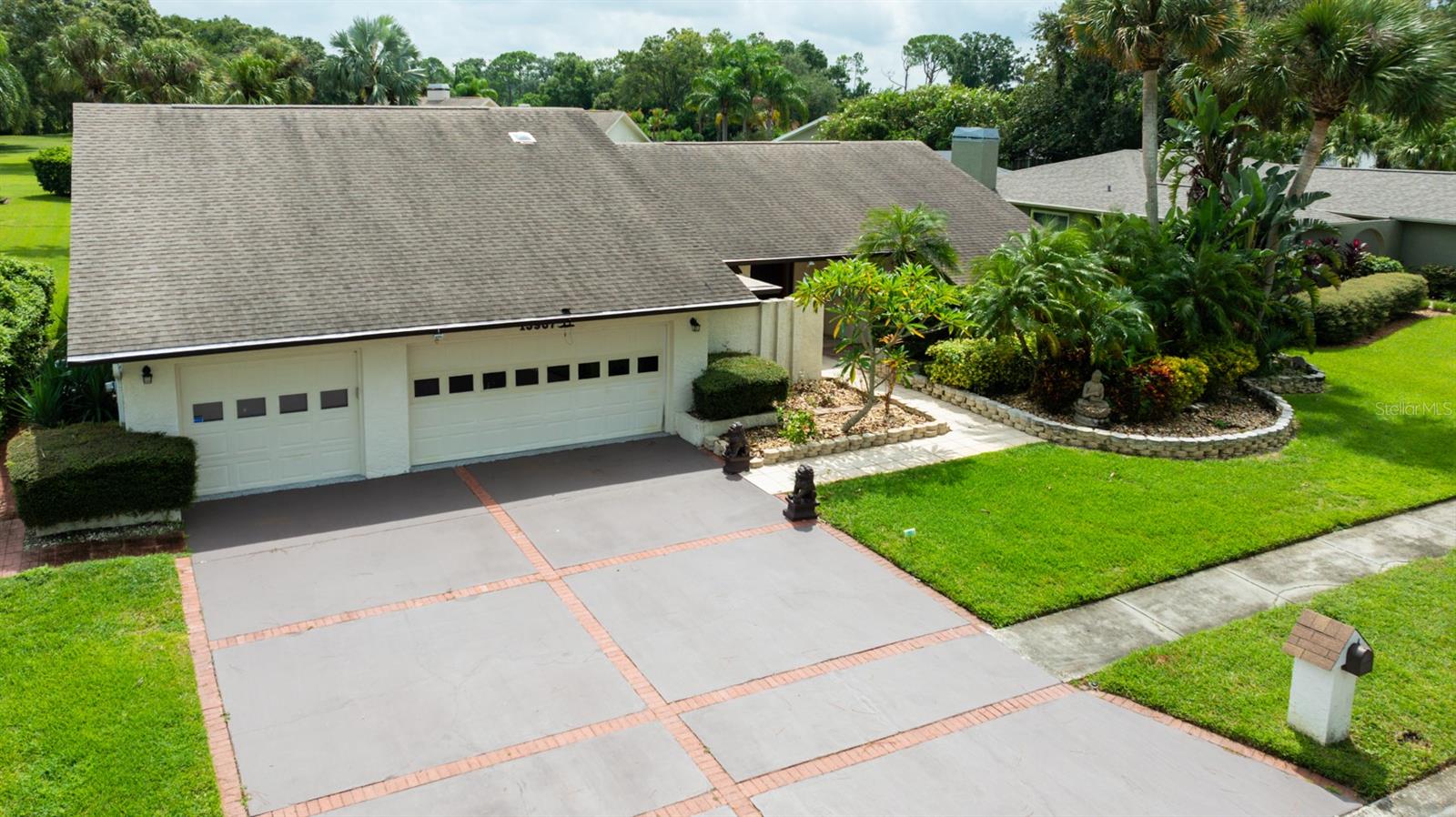 Discover an incredible opportunity in the heart of Carrollwood Village. Situated in the desirable Pepperell neighborhood,
this 5-bedroom, 4-bathroom, 3,226 sq. ft. pool home rests on an oversized 17,550 sq. ft. lot directly across from
Carrollwood Village Park and within ½ a mile of NY Bagel, the Perfect Press Coffee Co., and other modern conveniences. With
a recently renovated kitchen already complete, the home is primed for your vision and cosmetic updates to unlock its full
potential.
The versatile layout is ideal for modern living, offering a true split floor plan with the primary suite and adjacent
bedroom (perfect for an office or nursery) on one side, and three additional bedrooms on the other. A flexible 5th
bedroom/in-law suite includes a full bath and private entry or can easily convert back to a 3-car garage. Vaulted ceilings
with exposed beams, pocket sliding glass doors, a cedar-lined closet, spacious formal living and dining areas, and a massive
attic with built-in storage lift showcase the home’s character and functionality. The updated kitchen features extended
cabinetry with abundant storage, stainless steel appliances, quartz counters, a coffee bar, and a designer backsplash. From
there, enjoy seamless indoor-outdoor living with a screened lanai and pool area, an incredible backdrop to create your own
backyard retreat. A wide driveway with space for 4–6 vehicles, and lush mature landscaping completes the property. Enjoy
life in one of Tampa’s most established and sought-after communities, where neighborhood charm meets unmatched convenience.
Carrollwood Village offers parks, walking trails, pickleball and basketball courts, Carrollwood Country Club (membership
required), and a thriving market scene. With low flood risk, strong community amenities, and a location that continues to
grow in popularity, this property offers the perfect canvas to create your dream home in Carrollwood Village. Don’t miss the virtual walk through here: https://youtu.be/FKbp8CW24Bw?si=VCiDL0Q9F1fU4PBk