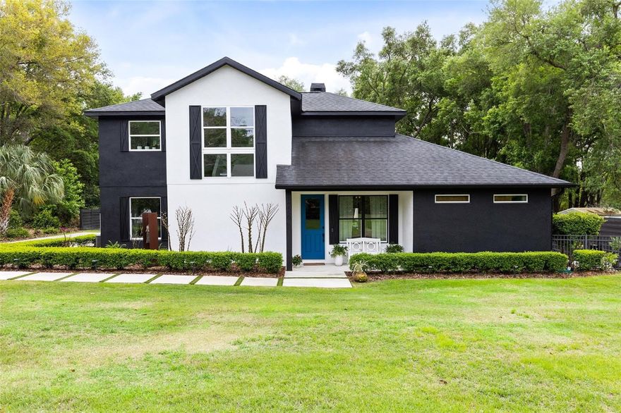 On a beautifully manicured half-acre lot with mature landscaping and stunning, large oak trees, this exceptional home offers refined Florida living and the feel of a private retreat in a desirable Montverde location with no HOA. Constructed just five years ago, the residence blends modern design with thoughtful functionality and upgrades throughout (improvements list available on request). The open-concept first floor is filled with natural light and features a contemporary kitchen with a large center island, ideal for gathering and entertaining, seamlessly flowing into the living and dining areas highlighted by a cozy fireplace. The spacious ground floor primary suite provides a serene escape with abundant sunlight, an elegant en-suite bath showcasing a walk-in shower with dual rainfall shower heads, a striking standalone soaking tub and twin custom-designed walk-in closets. Upstairs, two additional bedrooms are connected by a Jack-and-Jill bath, while a cozy den or study area offers flexible space for work or relaxation. Outdoor living shines with an inviting in-ground saltwater pool and large covered dining and seating space with outdoor kitchen, all opening to an expansive lawn and garden area flanked by majestic shady oak trees for year-round enjoyment, along with a raised vegetable garden for the ultimate farm-to-table experience. Adjacent to the pool is a secondary air-conditioned recreation room that can easily serve as an office, studio, pool house, guest house, man cave or she shed, adding incredible versatility. The community also offers lake access to Lake Florence, providing residents with the charm of lakeside living. Ideally near Montverde Academy and just minutes from the new Minneola Turnpike Exchange, there is easy access to SR 429 and SR 408, making commuting and travel convenient. This property combines privacy, modern comfort, and an outstanding location all in one extremely attractive and impressive package.