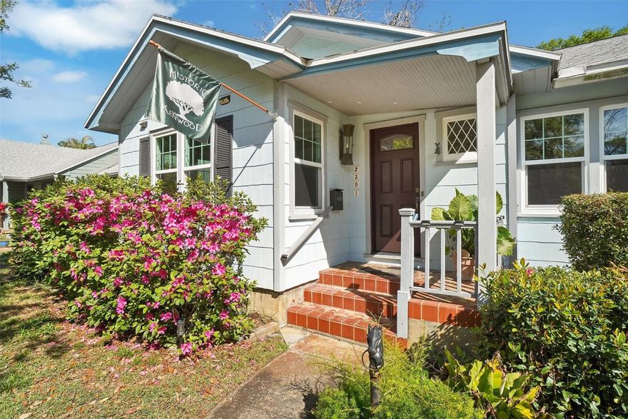 Welcome to the blue house, situated on a generous lot, conveniently located at the corner of 23rd and 7th streets! This charming 3-bedroom, 2-bathroom home features original, all-wood flooring throughout. The kitchen, a focal point of the home, boasts a vaulted ceiling, a gas stovetop, double ovens, and a large wet bar that leads to a full bath and a spacious outdoor porch/patio – ideal for enjoying the ambiance. The expansive front room is perfect for comfortable seating, accessories, and artwork. Situated in the highly desirable Historic Kenwood area. A top-rated neighborhood, the property features original brick-lined streets. The home includes a full-sized, attached 2-car garage and additional off-street parking. A large shed provides ample storage. The lush backyard awaits its initial landscaping. Do not miss this exceptional opportunity!