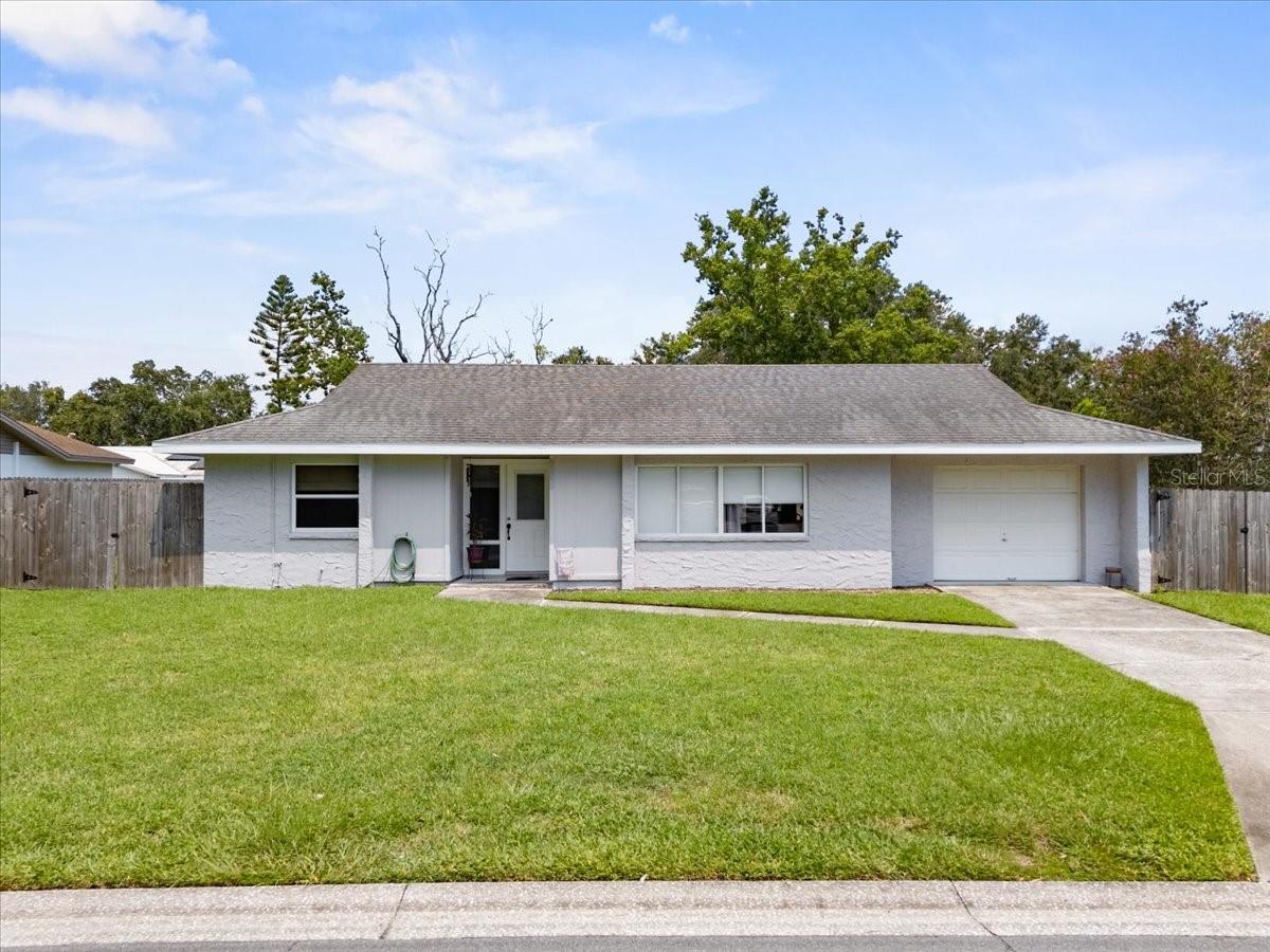 Welcome to this beautifully maintained home in one of South Lakeland’s most desirable neighborhoods. Inside, you’re greeted with a bright and spacious living room, a functional layout with all three bedrooms down the hall, and a private master suite that looks out over the fully fenced backyard. The kitchen features new stainless steel appliances and a bar that opens to the dining area, making it perfect for both casual meals and hosting. Just off the dining room, a large screened lanai offers the ideal spot to relax and enjoy the peaceful yard. Updates include fresh exterior paint, new soffits, a brand new HVAC system from 2024, and a new water heater from 2023. The best part? Everything stays—including all appliances and furniture. Centrally located with easy access to Polk Parkway, you're less than 20 minutes from Downtown Lakeland, Bonnet Springs Park, Circle B Bar Reserve, Lakeland Linder Airport, and right next to the all new Orlando Health Watson Clinic Lakeland Highlands Hospital. Tucked in a quiet and walkable neighborhood, you’re also just minutes from shopping, dining, and everything you need.