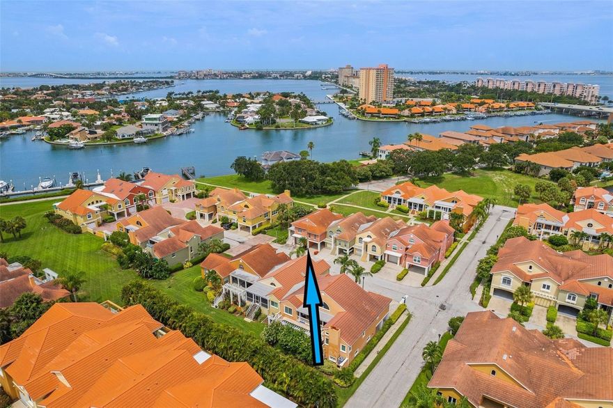 Nestled within 50 acres of lush, tropical landscape, sparkling ponds and resting on Boca Ciega Bay, the gated community of Marina Bay is a hidden jewel. This well-maintained townhome has an open floor plan with 1625 Sq Ft, all on one floor. There are 3 bedrooms, 2 full baths, large living and dining rooms and a spacious kitchen with granite countertops, new stainless steel appliances, gas range, a wine fridge, wood cabinets and plenty of storage. The living room, with vaulted ceilings and hardwood floors, opens to a beautiful, screened patio, updated with travertine tile floors, and a partial view of the Bay. Garden like setting with lots of winding pathways throughout the community. The master suite has 2 walk-in closets and sliding glass doors to the generous lanai. The ensuite master bath has a jacuzzi tub, separate shower, and dual sinks. So many extras in this stylish residence: plantation shutters, hardwood floors, soaring ceilings, new skylights, 2018 tile roof, tankless hot water heater, interior paint & so much more! As an added bonus, the entire ground floor is a huge, updated garage that can hold 3 cars plus a carport for 4th car, with additional storage space! Marina Bay is a gated, waterfront community featuring a clubhouse with fitness center, saltwater pool & spa overlooking the lake! You can also enjoy fishing from the community docks. Just minutes from the world class beaches of St. Pete and Ft. DeSoto, 10 minutes to the restaurants and museums of downtown St. Pete and 25 minutes from Tampa International Airport. Come see this wonderful condo today and start living the good life!