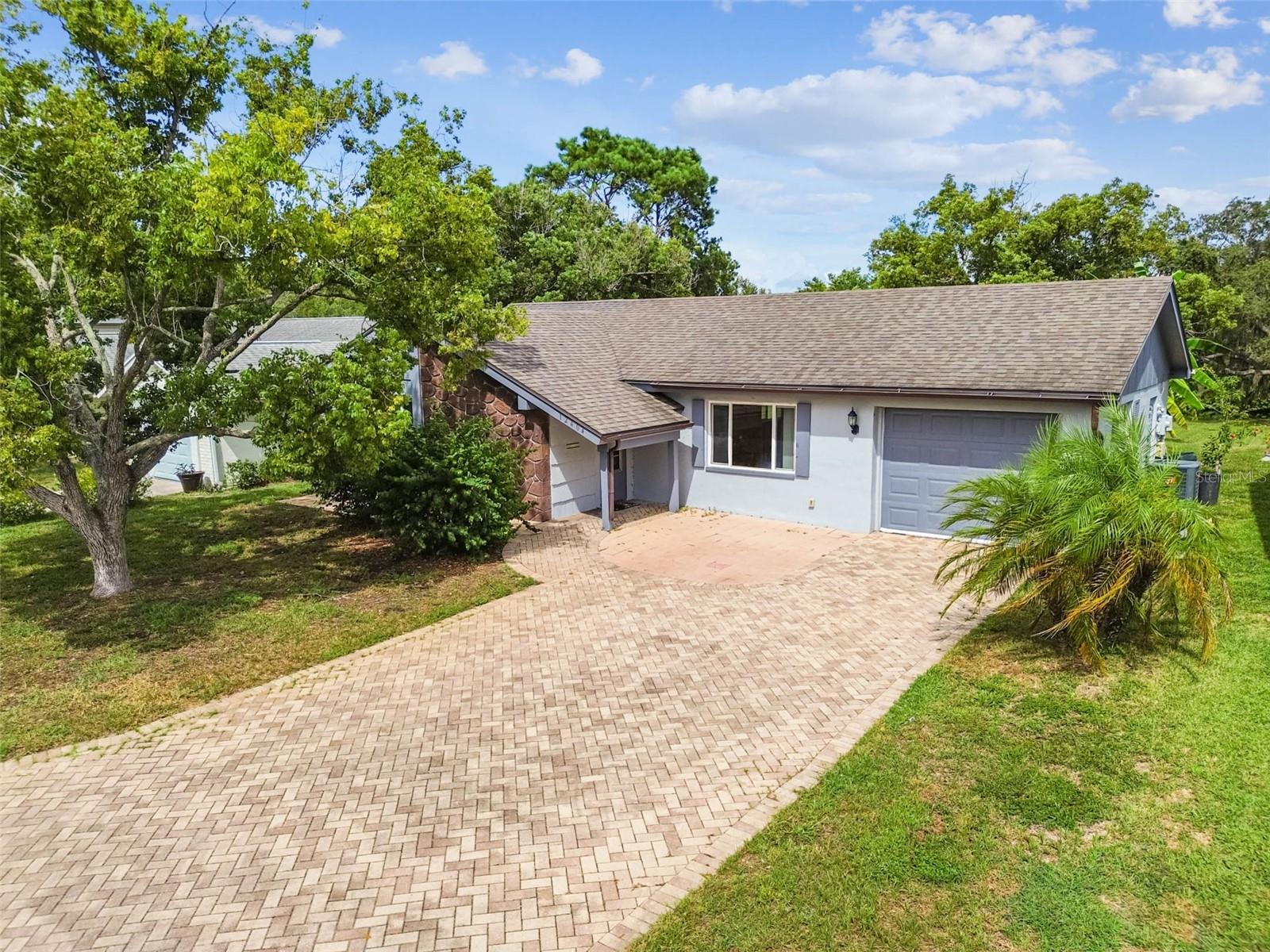 Welcome to this charming 2 bedroom, 2 bath home in the desirable Beacon Woods community! Situated on over a quarter of an acre, this property offers a versatile bonus room, perfect for a home office, guest space, hobby area, or 3rd bedroom. The home includes a 1-car garage and peace of mind with a roof and A/C replaced in 2019. Beacon Woods residents enjoy a wide range of amenities, including a sparkling community pool, shuffleboard, basketball courts, fitness center, 18-hole golf course, and a clubhouse for social gatherings. This home combines comfort, convenience, and community living in a prime location.(ROOF-2019)(A/C-2019)
