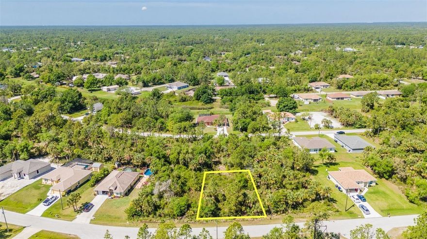 1/4 acre lot in North Port Estates! This quiet and tranquil property offers the perfect setting to build your dream home, surrounded by natural beauty while still being just 10 minutes from shopping and dining. Enjoy the freedom of no HOA or CDD fees, giving you flexibility to design and use your property as you wish. Located in one of the fastest-growing cities in Florida, this is a great opportunity to invest in an area with continued growth and development.