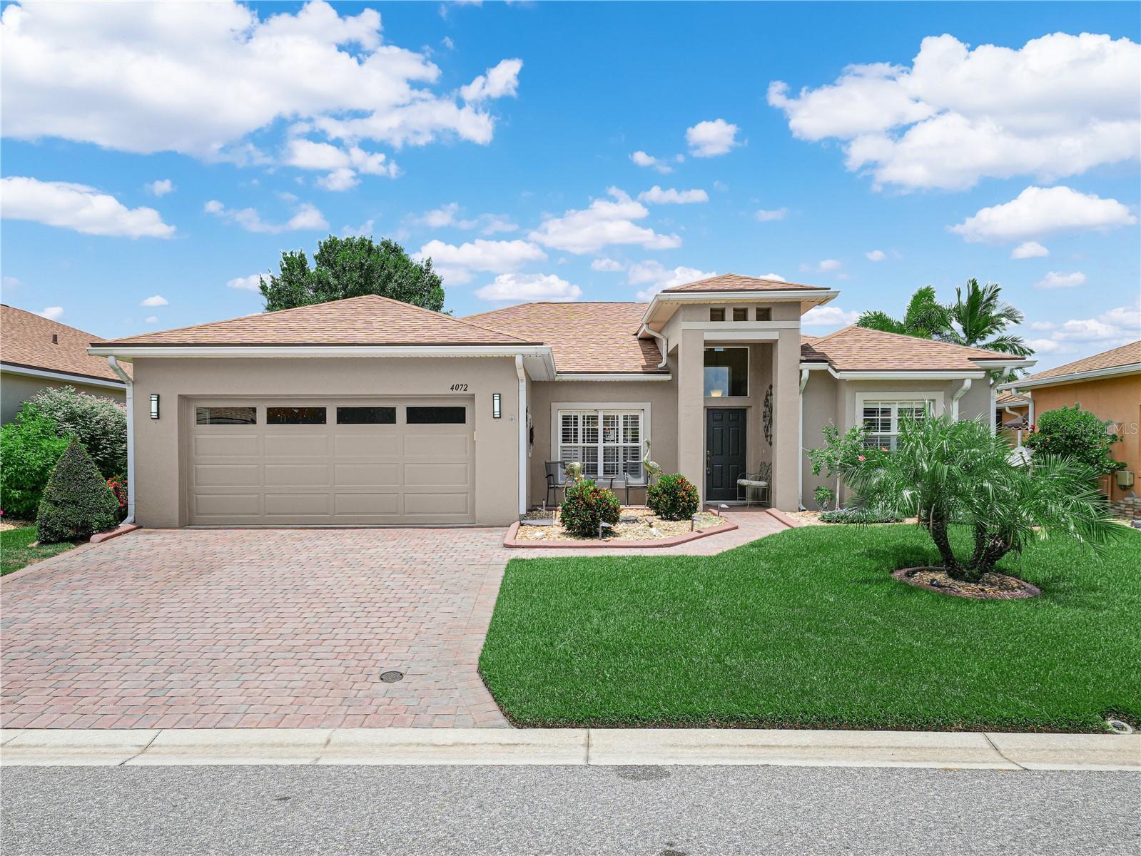 One or more photo(s) has been virtually staged. 4072 Birkdale Drive Lake Wales, Florida is a beautiful pool home located behind the gates of Lake Ashton, a 55+ community. This 3 Bedroom / 2 Bath home has an L Shaped Pool with screened enclosure. The spacious, covered lanai with pavers is the ideal place to entertain friends and family. The outdoor living space is accessible from the Primary Suite, Living Room and Family Room. This Monte Carlo floor plan home with over 1,891 sq.ft. living area has excellent curb appeal with a beautifully landscaped lawn with poured curbing around the landscaped areas. As you enter this home, the formal dining area is to your left and the Primary Suite is on the right hand side of the home, directly in front of you is the living room. Adjacent to the Kitchen is the Family room area with double glass sliders to the pool area and a dinette area. The kitchen is absolutely beautiful. It's a chef's delight with 42" cabinets with crown molding, ample counter space, tiled backsplash, under cabinet lighting and upgraded lighting. There are cabinet pull outs to help you keep your kitchen organized. This split plan home is functional and offers plenty of space. Bedroom 2 and Bedroom 3 are separated by a Guest Bath with comfort height vanity, shower/tub combo and a linen closet is in the hall for your storage needs. The Primary Suite has double glass sliders, His/Her walk in closets (one has a closet organization system) and a Primary Bath with large soaking tub, His/Her comfort height vanity, separate water closet and walk in shower. The laundry room is conveniently located to the kitchen and the garage door entry. The washer/dryer will convey with the sale of the home. The window treatments include deluxe window shades and surround sound is in some rooms throughout the home. Tile is in the living, dining, family, kitchen and bath areas and wood like flooring has been installed in the Bedrooms. The Solar Panels (Installed in 2015) are PAID IN FULL. The roof was replaced in 2021. Lake Ashton is a gated 55+ community with resort style amenities and planned activities. 2 Golf Courses, 2 Restaurants, Large Clubhouse with Movie Theater, Bowling Lanes, Card, Craft, Billiards and Fitness Center. Bocce Courts, Shuffleboard Courts, Tennis Courts, 2 Heated Pools (One Indoor and One Outdoor), Pickle Ball Courts, Indoor 1/2 Basketball, Indoor Racquetball, Saunas and SO MUCH MORE!!!!!