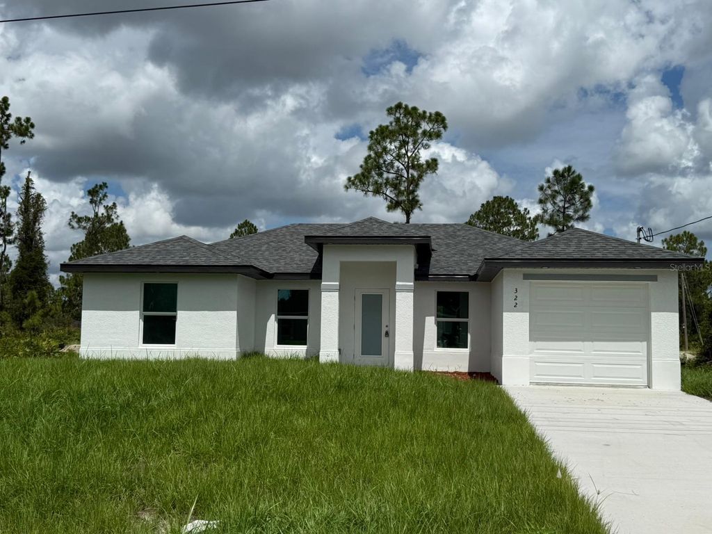Photo of 322 Mcarthur Boulevard, Lehigh Acres, FL 33974 (MLS # S5133262)