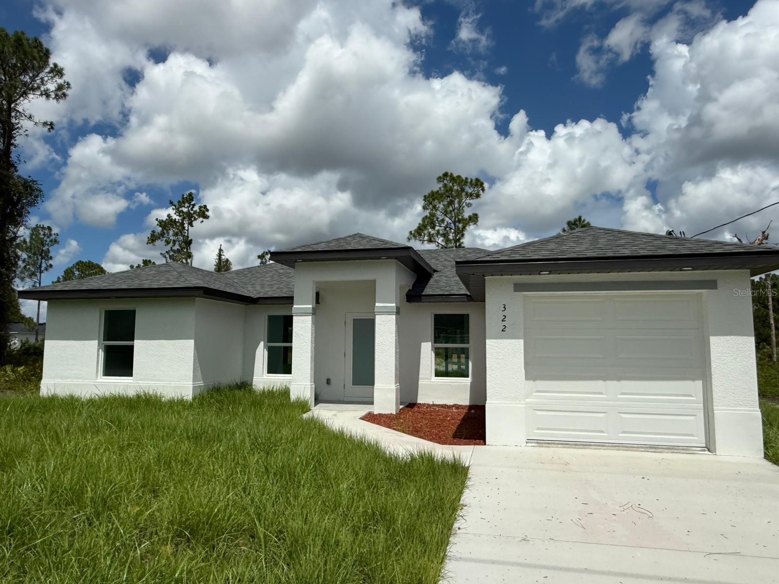 Welcome to your dream home! This stunning new construction single-family home in Lehigh Acres, offers the perfect blend of comfort in one
floor, style, and convenience. The home features 3 spacious bedrooms, including a master bedroom, 2 bathrooms, One-car garage for added
convenience and storage. Open floor plan perfect for entertaining and everyday living. Porcelain floors throughout, quartz countertops in
kitchen. Perfect Location for a relaxed lifestyle with easy access to shopping, dining, and entertainment. Enjoy the warm Florida climate and
outdoor activities like golfing, fishing, and exploring the nearby natural areas. Don't miss out this opportunity