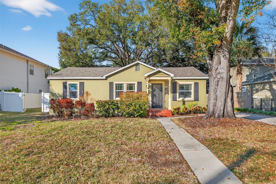 Tucked beneath a canopy of mature trees in the heart of South Tampa, this timeless residence invites you into a lifestyle defined by charm, connection, and everyday ease. Set on a generous 75 x 120 lot, this property offers the space to breathe, gather, and grow—all while being moments from the very best the city has to offer. Zoned for the highly sought-after Mabry, Coleman, and Plant school district, this home places you in the center of it all. From the moment you arrive, there’s a feeling that life simply fits here. The welcoming façade and expansive driveway greet family and friends with warmth, while inside, rich heart of pine wood floors stretch throughout the living spaces, telling a story of craftsmanship and character. With four bedrooms (4) and two baths (2), flexibility abounds. The primary owners retreat features soaring cathedral ceilings and an ensuite bathroom. There is also a guest suite with its own private entrance, ideal as a Mother-in-Law suite, offering independence and privacy for extended family or long-term guests while remaining thoughtfully connected to the main home. Thoughtful updates blend seamlessly with the home’s original soul, creating a space that feels both established and refreshingly current. A spacious family room flows into a dedicated dining area, creating a natural gathering place for holidays, celebrations, or relaxed dinners. The kitchen, complete with granite countertops, newer stainless-steel appliances, invites culinary creativity—whether you’re preparing Sunday brunch before a Bayshore stroll or hosting friends before a night out in Hyde Park. Just off the kitchen, a screened-in lanai offers the perfect spot for morning coffee or evening wine, seamlessly blending indoor and outdoor living. A newer roof provides peace of mind, and the home has never sustained storm damage—a rare and valuable distinction. Energy-efficient windows enhance year-round comfort, while an interior laundry room adds daily convenience. The current owner’s flood policy is assumable and just $2,900 per year. Step outside and discover where this property truly shines. The expansive fenced backyard feels like a private park—ready for memories to unfold. A newer deck spanning the entire width of the home creates an incredible extension of the living space, perfect for hosting large gatherings, grilling with friends, or dining under the stars. The screened lanai and full-width deck work beautifully together—one offering shade and comfort, the other open-air space for celebration—creating a backyard designed for year-round enjoyment. Imagine birthday parties under café lights, gardening on sunny afternoons, or quiet evenings gathered around a fire pit. Tucked into this remarkable yard is an air-conditioned workshop built on a concrete slab with insulated framing and windows—a versatile space limited only by your imagination. Today it’s a workshop; tomorrow it could be your private gym, art studio, home office, or an inviting guest retreat. Location here is more than convenient—it’s lifestyle-defining. Hyde Park Village’s boutiques and cafés are minutes away. Morning runs along Bayshore Boulevard, evenings in vibrant Downtown Tampa, quick departures from Tampa International Airport, and spontaneous weekends at the Gulf beaches are all within easy reach. This is more than a home—it’s a place where character meets comfort, community thrives, and where every day feels grounded, inspired, and unmistakably South Tampa.