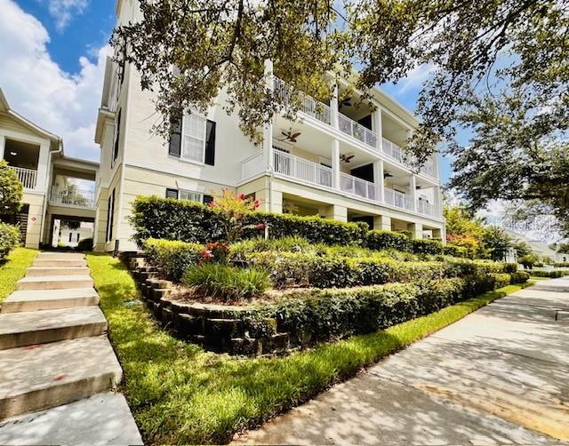 Here is a fine Georgetown, ground floor, corner unit with three bedrooms and two baths! Two masters with en suite baths and walk in closets, a laundry room and breakfast bar off the kitchen, this open floor-plan provides room to spread out. This 1594 square foot condominium faces south, and features a spacious-27 foot long-covered porch, with views of the North Village Park-close to the community pool, soccer field and volleyball courts. Georgetown residents have access to their own private pool, clubhouse, gym, tennis and pickleball courts. Water Tower Place, with a Publix and restaurants, is a short walk away. Georgetown is easily accessible from 192 and 417, and Town Center is right down Celebration Avenue-right where you want to be.
