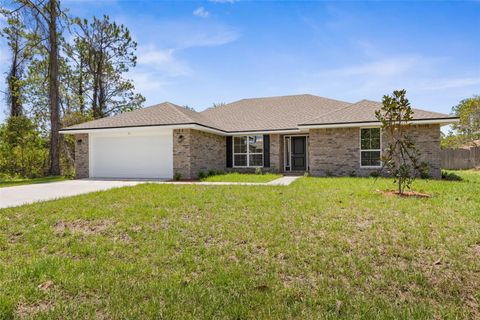 Photo of 18 Brushwood Lane, Palm Coast, FL 32137 (MLS # FC314129)