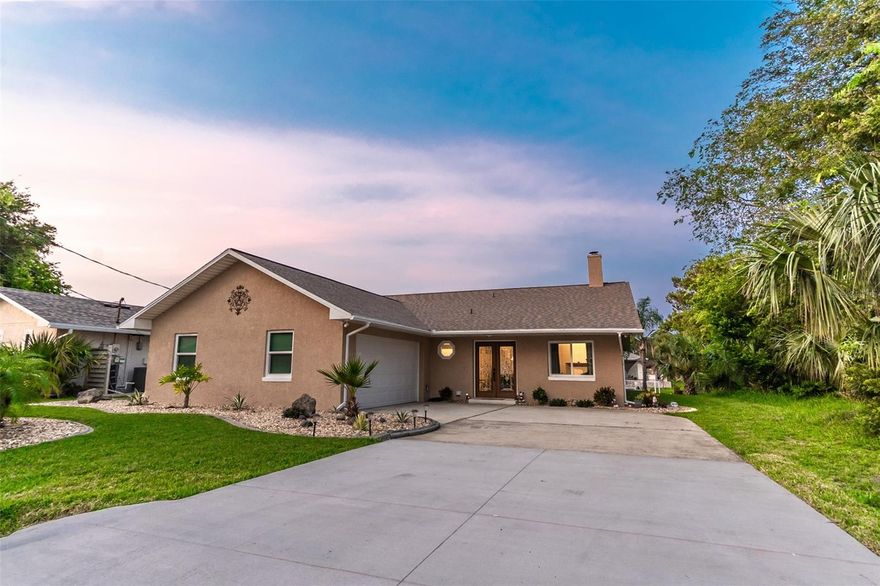 Here is your opportunity to live on the water in Sailboat Country
This gem has beautiful sunrises from this eastern exposure saltwater canal pool home provide excellent natural lighting to the spacious kitchen. This 3 bedroom, 2 bath split plan home has quick direct Intracoastal access in sailboat country. Enjoy the outdoors on your 44 foot pool deck including a 12 x 24 saltwater system with fountains and nighttime lighting. Entertain or simply relax on the 17 x 17 ceramic tile Florida Room overlooking the pool and canal. The bright open-concept floor plan connects the living, dining, kitchen areas and Florida Room for easy entertaining. The kitchen features windows that overlook the lanai, pool area and saltwater canal, SS Samsung appliances and wood panel cabinet doors with pull out drawers. The living room has vaulted ceilings, a wood-burning fireplace with a custom wood mantle and leaded glass double door entranceway. All main living areas have ceramic tile. Owner suite has a tray ceiling, walk-in closet, an en-suite bath with large, soaking jetted, tub and windows on both sides for great natural lighting. This home is definitely on a boater's wish list with a fully bulkheaded 60’ water frontage with dock. New windows, doors, roof, hot water heater and 3-ton Seer AC system with UV sanitizing. Meticulously maintained and move in ready.