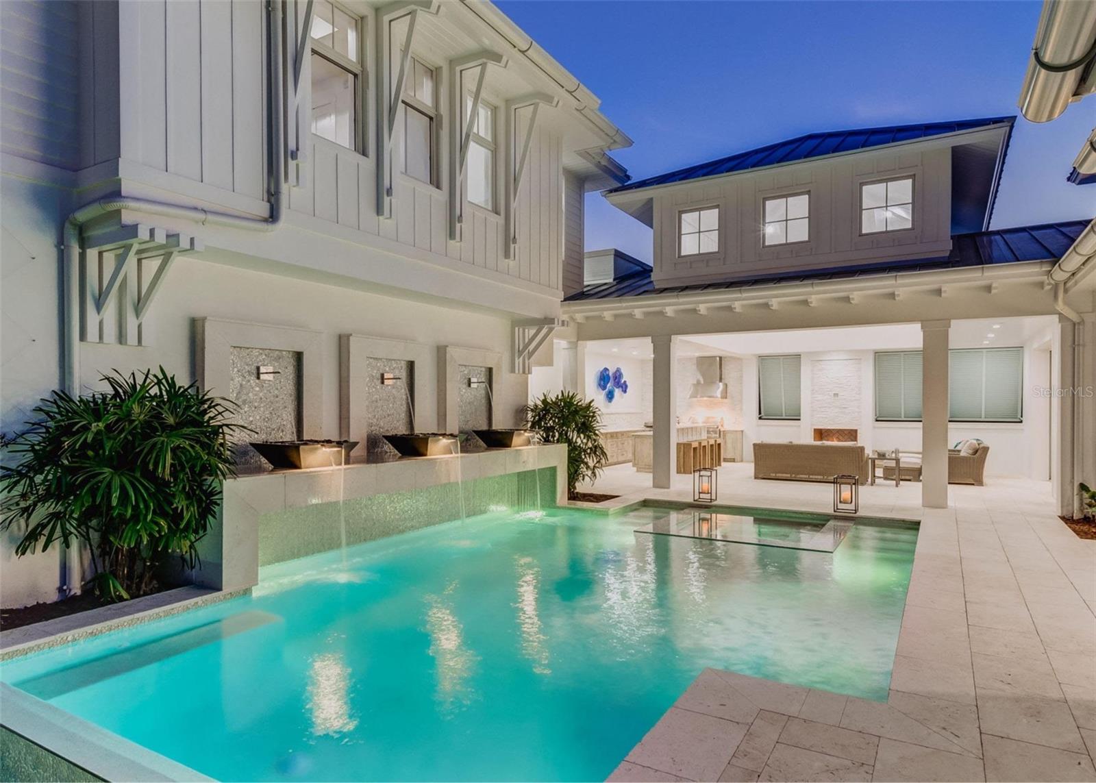 Pre-Construction. To be built. Brought to you by Noah Thomas Builders, this brand-new courtyard-style home embodies the relaxed sophistication and refined design that define Siesta Key living. Blending West Indies architectural influences with contemporary luxury, every element of this residence has been meticulously curated for comfort, beauty, and lasting quality. From the moment you arrive, a sense of serenity surrounds you. Step through the grand entry into your private courtyard oasis, complete with a sparkling pool, spa, and tropical landscaping — the heart of the home and a true reflection of Florida’s indoor-outdoor lifestyle. Multiple living spaces open directly to the courtyard, allowing natural light and coastal breezes to flow freely throughout the residence. Inside, the expansive open-concept layout features soaring ceilings, and walls of glass that pool views. The gourmet chef’s kitchen is a statement of style and function, with custom cabinetry, premium appliances, and a generous island ideal for entertaining. A separate dining space and living area connect seamlessly to the outdoor lounge, creating an effortless flow for gatherings large or small. The owner’s suite offers a private retreat with a luxurious spa bath with soaking tub and walk-in shower, dual vanities, and oversized custom closets. Additional guest suites are thoughtfully positioned for privacy, each with elegant finishes and access to the home’s outdoor spaces. Built to exceed FEMA’s latest coastal construction standards, this home showcases hurricane-rated windows and doors, solid block construction, and elevated design standards that deliver both strength and sophistication. Every detail reflects Noah Thomas Builders’ signature craftsmanship, ensuring your investment is as enduring as it is beautiful. Located on Siesta Key’s exclusive Roberts Point, this property offers the perfect balance of privacy and proximity — minutes from world-renowned Siesta Key Beach, boutique shopping, fine dining, and the vibrant charm of Sarasota. This residence captures the true essence of coastal luxury living — elegant, resilient, and designed for effortless enjoyment. All images, renderings, and descriptions illustrate the intended design and style by Noah Thomas Builders. Finishes, materials, and specifications may change during the build process. Pricing, availability, and final details subject to adjustment prior to completion.