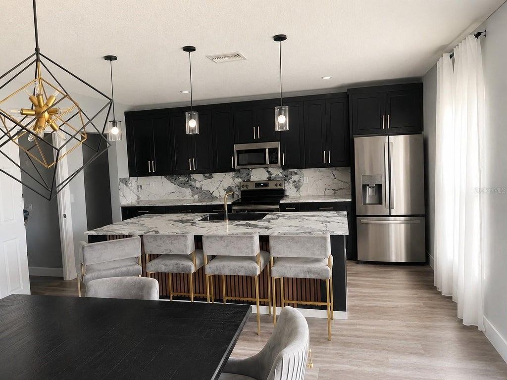 Photo of 1436 Axel Circle, Winter Haven, FL 33880 (MLS # L4964795)