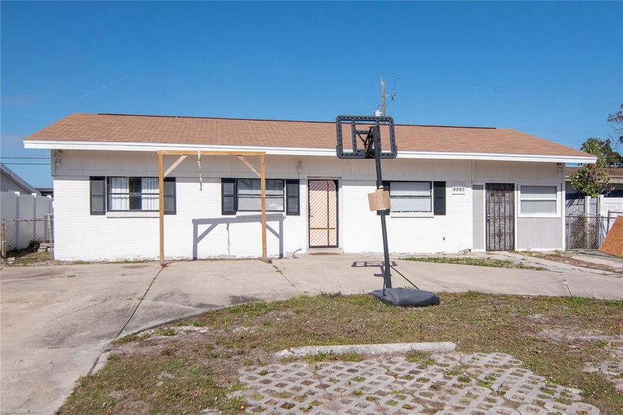 One or more photo(s) has been virtually staged. Come see this centrally located 5-bedroom, 2.5-bath single-family home offering 1,736 sq ft of heated living space. The flexible floor plan features a main living room plus a separate family room, along with a versatile bonus room which includes an adjoining half bath that can be used as a 5th bedroom, home office, guest suite, or income-producing efficiency with it's own entrance! Current updates include a 2020 roof, updated electrical panel, and an A/C system approximately 8 years old. Included appliances are the refrigerator, stove, microwave, and washer. Exterior features include a  fenced yard that's perfect for hosting, a patio, storage shed, and an expansive front parking area suitable for multiple vehicles. With no HOA, owners have added flexibility for future customization. This home is located in a very convenient part of Tampa. The Veterans highway leaves you fifteen minutes from Tampa International Airport, 25 minutes to both Downtown Tampa and Downtown St. Petersburg, and just 30 minutes to hit the beaches. Schedule your showing today!