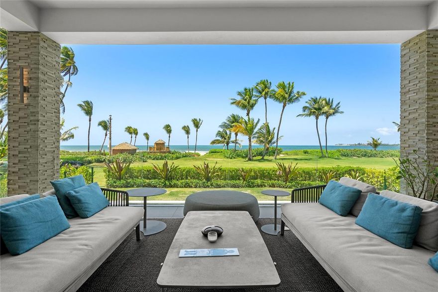 Feels like a home by the sea, park at your doorstep, skip the elevator and step directly into your private residence. From there, flow out to your own pool, lawn, and beach, a rare beachfront experience at the Four Seasons Resort & Residences Puerto Rico.  This first-floor garden residence spans 6,190sqft of indoor–outdoor living, designer-furnished by Hirsch Bedner Associates and move-in ready. Enjoy a private heated salt-water pool, spa jacuzzi, outdoor shower, and lush fenced yard. The Wolf/Sub-Zero kitchen includes a special-order double oven and connects to a fully equipped al-fresco kitchen for effortless entertaining. The primary suite features dual custom closets and a pre-plumbed wellness room ready for sauna, steam, or cold-plunge installation. Smart-home upgrades include Savant & Lutron automation and whole-home audio, paired with EV-ready parking and a 6-seat golf cart. Ownership includes the option to join the Four Seasons Resort & Residences Puerto Rico Hotel Service Program, offering access to five-star amenities, golf, spa, fitness, dining, and miles of nature trails—within Puerto Rico’s only Audubon Gold-Certified sanctuary. Owner financing available. Step from your private yard onto the shoreline and feel the Caribbean breeze, an effortless expression of luxury at Ocean Drive. This corner residence blends modern architecture with a relaxed island sensibility.
Floor-to-ceiling glass floods the open-plan living spaces with natural light, framing tropical foliage and the sea beyond. Retractable glass walls dissolve boundaries between indoors and out, opening to landscaped grounds perfect for morning swims or sunset gatherings.
The chef’s kitchen pairs Wolf and Sub-Zero appliances with Italian cabinetry and a generous island, while the adjacent outdoor kitchen makes entertaining under the stars effortless.
Private Quarters
The primary suite serves as a personal retreat with dual custom closets and a spa-inspired bath. A dedicated wellness space is prepped for sauna, steam, or cold-plunge installation. Three additional en-suite bedrooms—each with bespoke storage—ensure guests enjoy hotel-level privacy.
Smart & Turnkey
Integrated Savant and Lutron systems, whole-home audio, water softener, dedicated laundry, and private EV charging station elevate everyday ease. Two deeded parking spaces, a 6-seat golf cart, and 24-hour guard-gated entry provide convenience and peace of mind.
Four Seasons Resort & Residences Puerto Rico - Ownership includes privileged access to championship golf, farm-to-table dining, a state-of-the-art wellness and tennis center, full-service spa, miles of nature trails, and on-property water-sport adventures—all within the 483-acre, Audubon Gold-Certified sanctuary of Bahía Beach.

Whether you seek a legacy beachfront retreat or a savvy investment enhanced by rare owner financing, Garden Residence 101 delivers what discerning buyers value most: privacy, wellness, turnkey simplicity, and the prestige of a globally celebrated resort address.