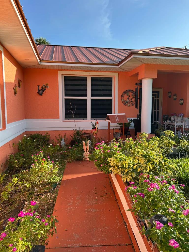 Come see this beautifully updated and freshly painted 3 bed 2 bath home. This home offers tons, from the new ceramic tile, to updated guest bathroom, and updated master bathroom. The kitchen appliances have been upgraded with a new stove, dishwasher, refrigerator/freezer, and matching microwave replaced August 2025. In addition, the laundry includes a washer, and dryer also replaced earlier this year. The water heater, and garage door opener have both been updated in 2025. If that isn't enough, the home offers a screened in lanai, with tile flooring, lights, and fans to offer a peaceful paradise in your own back yard. The show stopper would likely be the new metallic roof, providing you peace and comfort regardless of the weather. The home has a septic system recently pumped, sprinklers installed in 2024, and a complete reverse osmosis system for the whole house. More pictures to come.