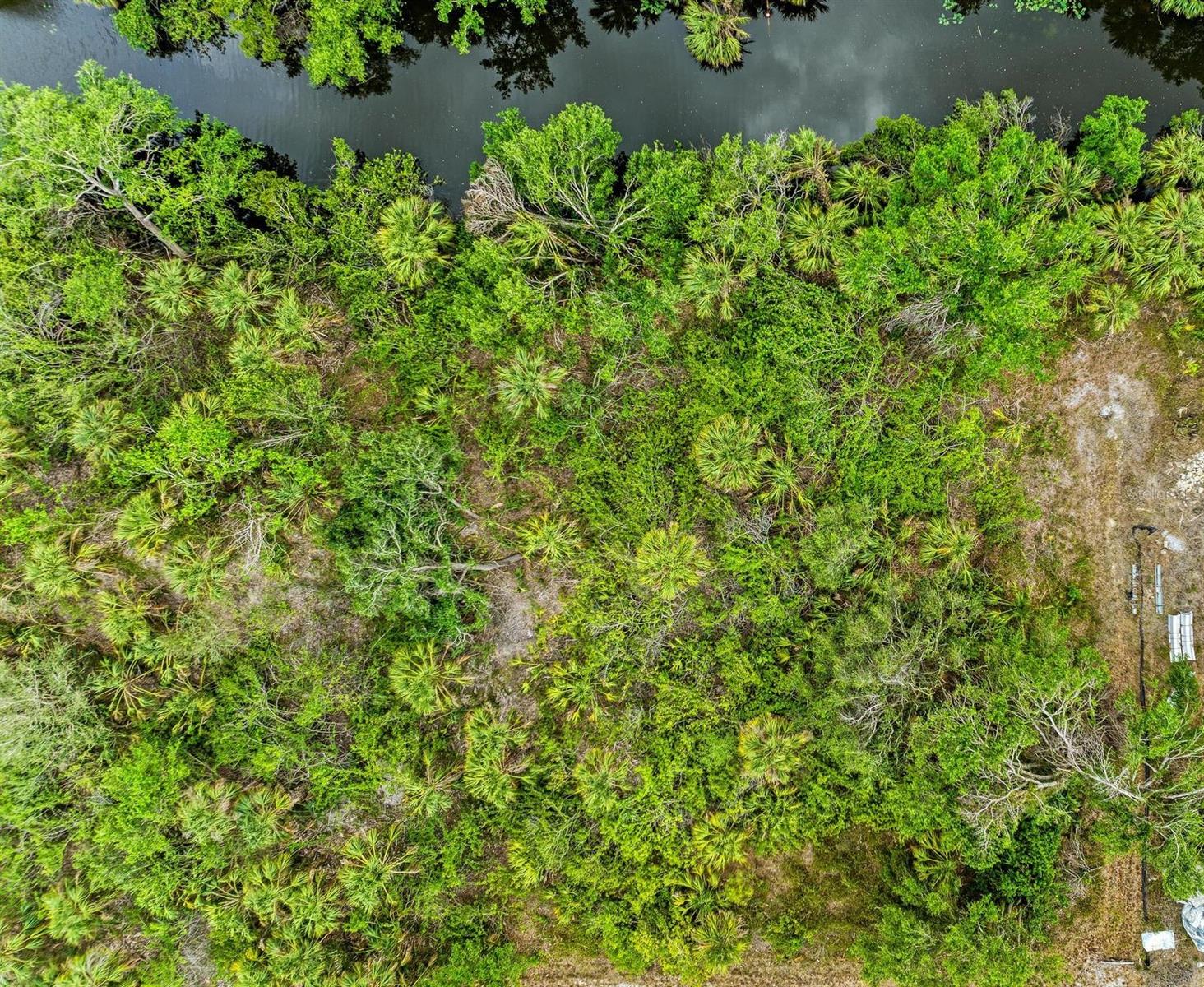 Great freshwater canal lot in North Port. Close to great schools, Atlanta Braves spring training, North Port Aquatic Center (water park), and beaches.
