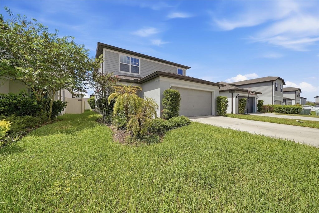 Photo of 9469 Rally Spring Loop, Wesley Chapel, FL 33545 (MLS # A4706814)