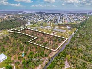 Rare Opportunity -Nature Lovers Dream! 6 Acres Prime Waterfront Land in Very Sought After Pirate Harbor! Discover the ultimate in Florida living with this exceptional 6 - Acre parcel offering 400 feet of direct water frontage in highly desirable Pirate Harbor community. This rare find provides endless potential- whether you're dreaming of a luxury waterfront estate with panoramic views, and tropical landscaping or looking to develop up to 15 custom homes in one of the areas most sought -after boating and fishing destinations. Enjoy access to charlotte harbor and the gulf of Mexico , all while being minutes from dining , shopping and entertainment in Punta Gorda and Port Charlotte. Pirate Harbor is a hidden gem known for Beautiful and serene natural surroundings. with zoning and utility access available , this property is ready for your vision - Build your dream or create an exclusive enclave of water front homes. Don't miss the chance to own or develop a piece of paradise. Opportunities like this are incredible rare in Pirate Harbor.