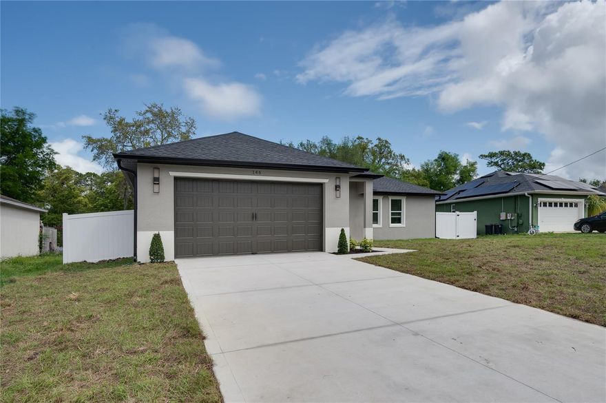 BRAND NEW CONSTRUCTION IN THE HEART OF DEBARY! Move-In Ready Luxury, Design, and Comfort. Located in the highly sought-after heart of DeBary, this impeccable, brand-new block home with 1,629 sq. ft. of perfectly distributed architectural space, every detail of this 3-bedroom, 2-bathroom property has been thoughtfully designed for a modern lifestyle, elevating comfort and elegance to the next level. From the moment the impressive 8-foot entry wood door welcomes you, you'll know this is no standard builder-grade home. The fully open-concept design flows naturally, offering clearly defined spaces for the living room, dining area, and kitchen—creating the ultimate environment for family life and entertaining. Spanish porcelain floors and high ceilings immediately set an undeniable standard of luxury. A Magazine-Worthy Kitchen:Prepare to fall in love. The kitchen features 100% solid wood cabinetry that perfectly complements the spectacular quartz countertops. It includes high-end touches rarely seen at this price point, such as a wall-mounted pot filler over the range for a professional culinary experience, stainless steel appliances, a spacious walk-in pantry, and a large center island. Love to host? The elegant built-in dry bar—complete with a wine cooler, wine rack, and sleek black accents—creates a sophisticated atmosphere for your guests. Your Private Sanctuary (Primary Suite):The expansive primary suite, accented with an elegant tray ceiling, is the ultimate retreat at the end of the day. It features an innovative "his and hers" walk-in closet concept. The en-suite bathroom is a true spa experience: double sinks and an oversized, tall shower featuring floor-to-ceiling luxury ceramic tile that will completely transform your daily routine. Privacy and Comfort for Everyone:The split floor plan strategically places the secondary bedrooms on the opposite side of the home. You'll find an oversized guest bedroom with its own walk-in closet, a modern full guest bathroom with a tub, and a third bedroom overlooking the backyard. Key detail: All bedrooms come fully equipped with ceiling fans, window blinds, and pre-wired wall mounts for easy, cable-free TV installation! Work & Practicality:Working from home or need a dedicated homework station? This house features a designated area ready to plug in your computer setup. Additionally, enjoy a large laundry room complete with a utility sink and a storage closet for all your cleaning supplies. The Garage You've Always Wanted:A spectacular 2-car garage with showroom-level finishes: epoxy floors, an 8-foot garage door with an opener included, and it comes EV-ready for your electric vehicle charger.  Your Outdoor Oasis:Enjoy the Florida lifestyle on your 16-foot covered lanai—the perfect spot for all kinds of entertaining—overlooking a fully flat, private backyard enclosed by a brand-new privacy fence. The home also comes with seamless rain gutters installed around the entire roofline, a premium detail that protects your investment. Unbeatable Location:Just minutes from I-4, offering a stress-free commute to Orlando or a quick escape to the beaches. It is incredibly rare to find a unique opportunity that truly checks all the "must-have" items on your list with this level of upgrades already included. Come see the house for yourself and experience what a fully upgraded new home has to offer.  Contact me today to schedule your exclusive private tour.