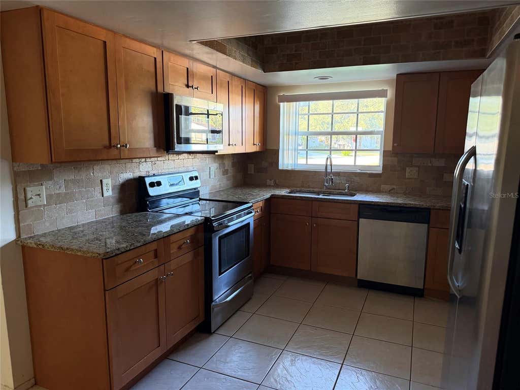 Photo of 4805 Landover Circle, Orlando, FL 32821 (MLS # O6422334)