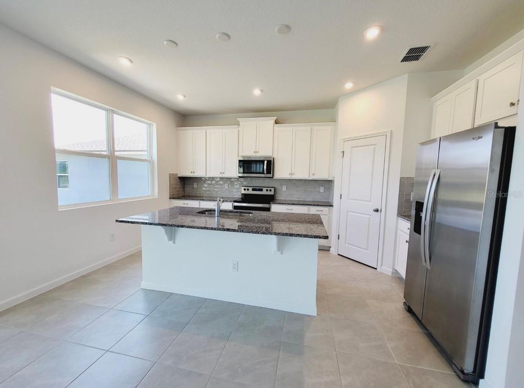 Photo of 9051 Coral Cape Street, Kissimmee, FL 34747 (MLS # O6363886)