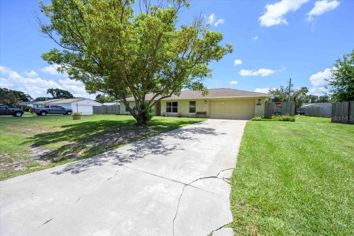 Welcome to your own private slice of paradise! This charming 3-bedroom, 2-bathroom home offers the perfect blend of comfort, functionality, and outdoor enjoyment. Tucked in a quiet, established neighborhood with no HOA or CDD, you’ll enjoy the freedom to live life your way—whether that means parking your boat, hosting backyard barbecues, or jumping into your very own above-ground pool with custom stairs and deck. Step inside to find a warm, welcoming layout and an attached 2-car garage that provides plenty of storage and convenience. The large screened patio becomes an ideal space for morning coffee or evening gatherings, overlooking the oversized fenced backyard—a true outdoor retreat! There’s enclosed, covered storage perfect for your boat, ATV, or lawn equipment, plus a dedicated workshop with additional storage that’s ready for hobbies, projects, or perhaps your dream she-shed or man-cave. Set on a generous lot with plenty of room to roam, this property offers peace, privacy, and endless possibilities. Whether you're starting a family, downsizing with space to spare, or simply searching for a home that fits your active lifestyle, this one checks all the boxes. Don’t miss your chance to call this versatile and lovingly maintained home your own—schedule your private tour today and imagine the memories waiting to be made!