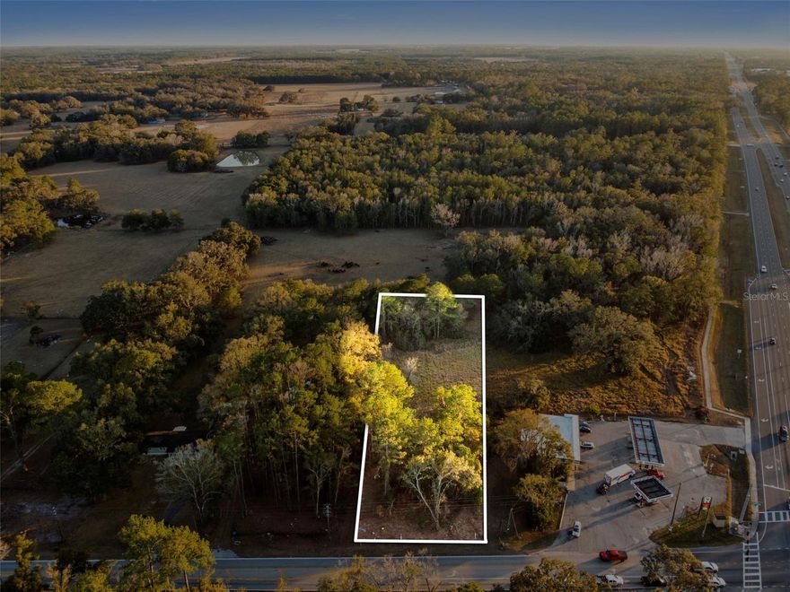 Prime 1-acre opportunity in Brooksville—partially cleared and positioned directly behind the 7-Eleven, giving you easy access, convenience, and strong “future potential” in a rapidly changing area. This parcel is ideal for buyers who want usable acreage now with the benefit of being near major traffic and services—perfect for a private homesite setup, weekend getaway, small-scale agricultural use, or long-term land hold as the surrounding area continues to develop. The property is currently zoned AG, offering flexibility for agricultural or residential use, while its location may present future rezoning potential for commercial uses, subject to county approval. Enjoy the best of both worlds: room to breathe with the convenience of town just steps away.