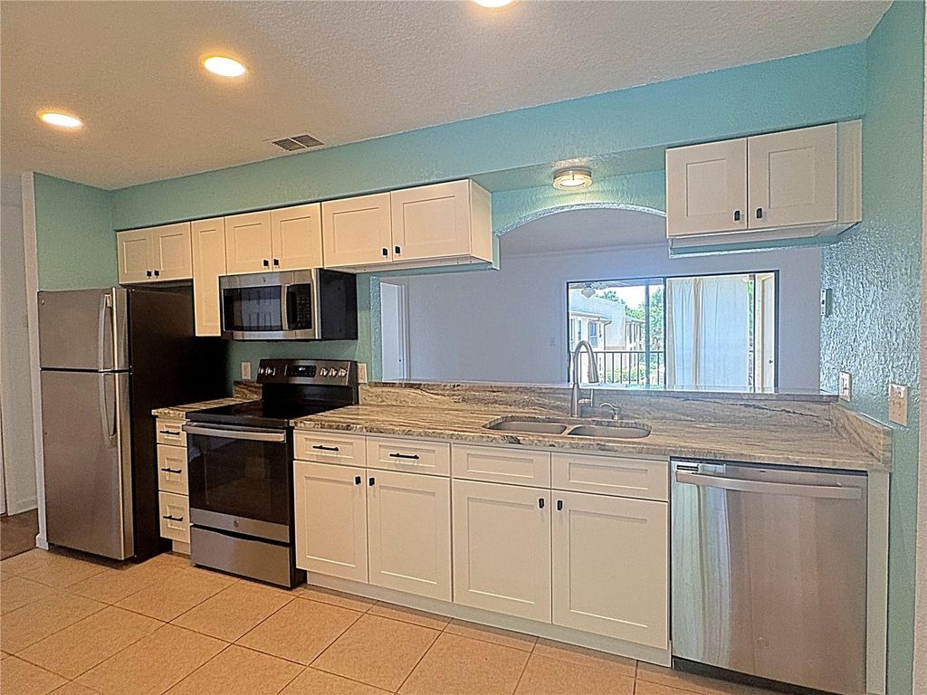 Photo of 12261 Sailwinds Drive #203, Largo, FL 33773 (MLS # TB8495065)