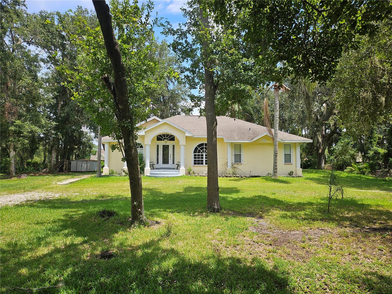 Very nice 3 bedroom 2 bath home on 1/2 acre of land. This home has 1,936 sq ft. of living area and is in a great location! The home has split bedrooms, a large living room and an additional bonus room for large gatherings. The primary bedroom has his and her walk-in closets and French doors that lead to the bonus room area. The primary bathroom has a large shower and separate garden tub along with a large vanity. The bedroom area is 16' x 12' and has a tray ceiling. The roof was replaced in 2020. The property has a circular driveway with lots of mature landscaping. There is a shed in the backyard. LOCATION! LOCATION! LOCATION! There is no HOA! The property has easy access to I-4 for an easy commute, is close to restaurants, shopping, etc. This property is not in a flood zone.