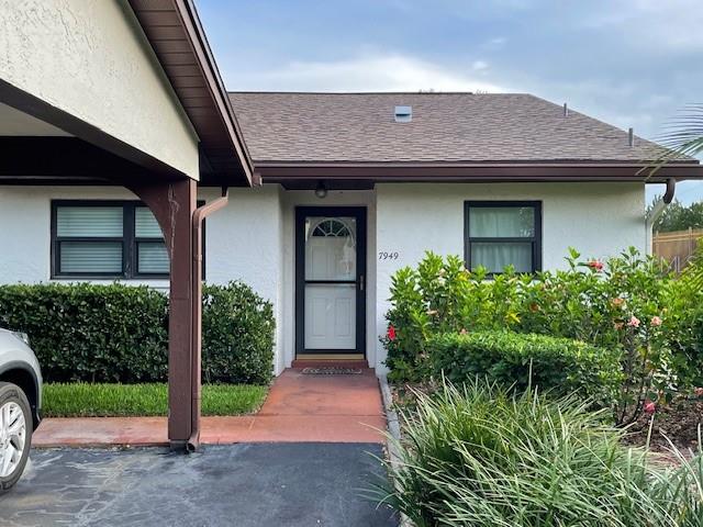 Welcome to this charming 2-bedroom, 2-bathroom condo located in the desirable gated community of the Orchards of Radcliffe in Port Richey, FL. This private corner unit offers extra peace and quiet, with neighbors on only one side and a north-south orientation that helps keep the home cooler year-round. An added kitchen window fills the space with light, and the kitchen features a 2024 Insinkerator and refrigerator. Inside, thoughtful updates include 6- panel interior doors and frames throughout, as well as new plantation blinds in the sunroom for a clean and timeless look. The master bathroom has been beautifully updated with a new ceramic tile shower, a modern shower head and faucet, new ceiling light, and fresh flooring. Additional upgrades include a new air handler and condenser (2024), a new 30-gallon hot water heater, and a security system with a keyless front door entry for peace of mind. Outside you’ll find your own individual storage space conveniently located in the carport. Residents of the Orchards of Radcliffe enjoy the benefits of the gated community, complete with a sparkling pool and clubhouse that hosts neighborhood events. This well-maintained condo offers comfort, privacy, and community all in one package-ready for you to move in and make it your own.
