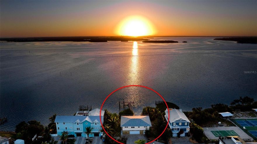 CONFIRMED POTENTIAL FOR TWO BUILDABLE WATERFRONT LOTS - This rare offering features nearly 100 feet of direct bay frontage in the heart of Bradenton Beach, where expansive open-water views stretch from sunrise to sunset.

A 75-foot composite dock (2019) with a 4,500 lb. boat lift (2014) extends into the bay, creating an ideal setting for boating, fishing, or simply unwinding as the water shifts with the light throughout the day. The existing residence is original and centrally positioned on the parcel, presenting a clear opportunity for redevelopment.

Whether envisioning a private bayfront estate or two distinct luxury homes, the property offers flexibility supported by its exceptional lot width, depth, and unobstructed views. 

Surrounded by high-end new construction, this location continues to prove its long-term value. Opportunities with this combination of frontage, development potential, and setting are increasingly limited on Anna Maria Island.

From quiet mornings on the dock to the stillness of the bay at dusk, this is a property that offers both a place to build and a reason to stay.