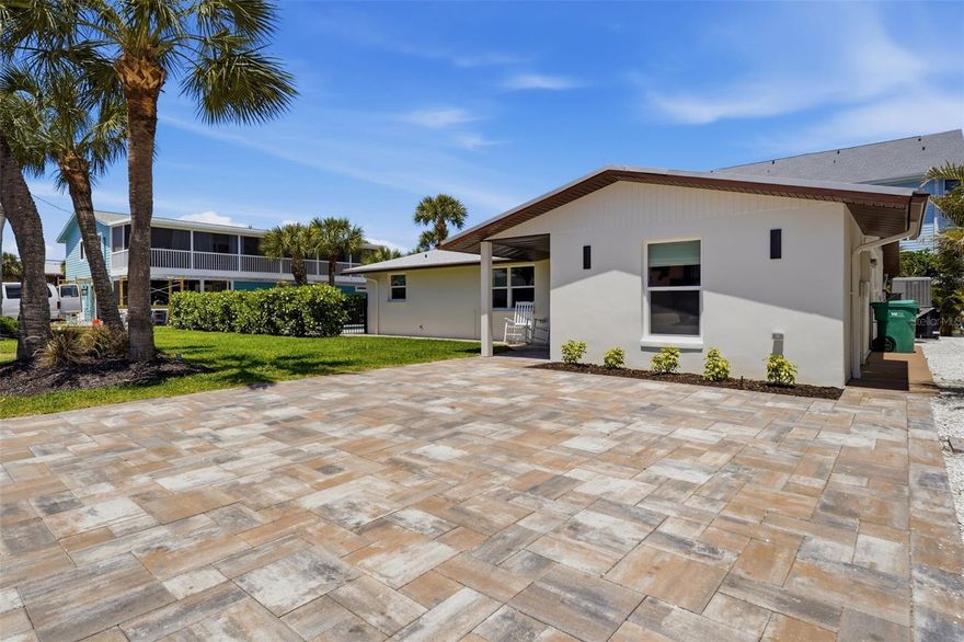 HUGE PRICE IMPROVEMENT + NOW PROFESSIONALLY FURNISHED & DECORATED! CHECK OUT THE NEW PHOTOS!! Seller has provided insurance inspections and quotes. This fully reimagined Manasota Key retreat is now completely styled with brand-new designer furnishings—creating the perfect luxury vacation home, high-performing short-term rental, or full-time coastal residence. A truly RARE opportunity to own in one of the most sought-after locations on Manasota Key—featuring deeded BEACH ACCESS, BAY ACCESS with TWO PRIVATE BOAT LIFTS, and a brand-new HEATED & COOLED POOL. Located on the highly desirable south end of Manasota Key Circle, this prime location allows you to walk everywhere—the beach, your boat, restaurants, and local shops—placing you in the heart of the island’s most vibrant, action-filled area. Completely reimagined from the ground up, this home showcases a new floor plan, luxury finishes, and extensive upgrades throughout. The beautifully designed kitchen features a large island with stone countertops and brand-new stainless steel appliances—ideal for entertaining or relaxed coastal living. Tile flooring runs throughout the main living areas, while the bedrooms offer added comfort. A flexible space provides options for a formal dining area, office, or den. The split floor plan offers privacy and functionality, highlighted by an oversized primary suite with dual sinks and a walk-in shower. Two guest bedrooms are thoughtfully positioned on the opposite side, including one with an en-suite bath and another with direct access to a third full bathroom. An inside utility room with washer and dryer adds convenience. Step outside to your brand-new 24x12 pool with heater and chiller, designed for year-round enjoyment. Shade sails, ambient lighting, wrought iron fencing, and mature landscaping create a private, resort-style setting. Wiring is already in place for a future hot tub and cold plunge. Major upgrades provide peace of mind, including closed-cell spray foam insulation, all-new electrical (200-amp), plumbing, HVAC and ductwork, impact windows and doors, and a durable metal roof, along with a new paver driveway, wraparound walkways, and irrigation system fed by an on-site well.  Your deeded beach access just across the street leads to a more private stretch of Gulf shoreline—perfect for sunset walks. Boaters will appreciate deeded dock access with TWO private lifts, power, and water on Lemon Bay, offering no bridges to the Gulf.  With NO HOA and NO RENTAL RESTRICTIONS, this property delivers exceptional flexibility and income potential. Whether you're seeking a personal island escape or a turnkey investment, this home offers a rare combination of beach + bay + boating + pool + walkability that is nearly impossible to find on Manasota Key.  Opportunities like this are incredibly rare—schedule your showing today.
