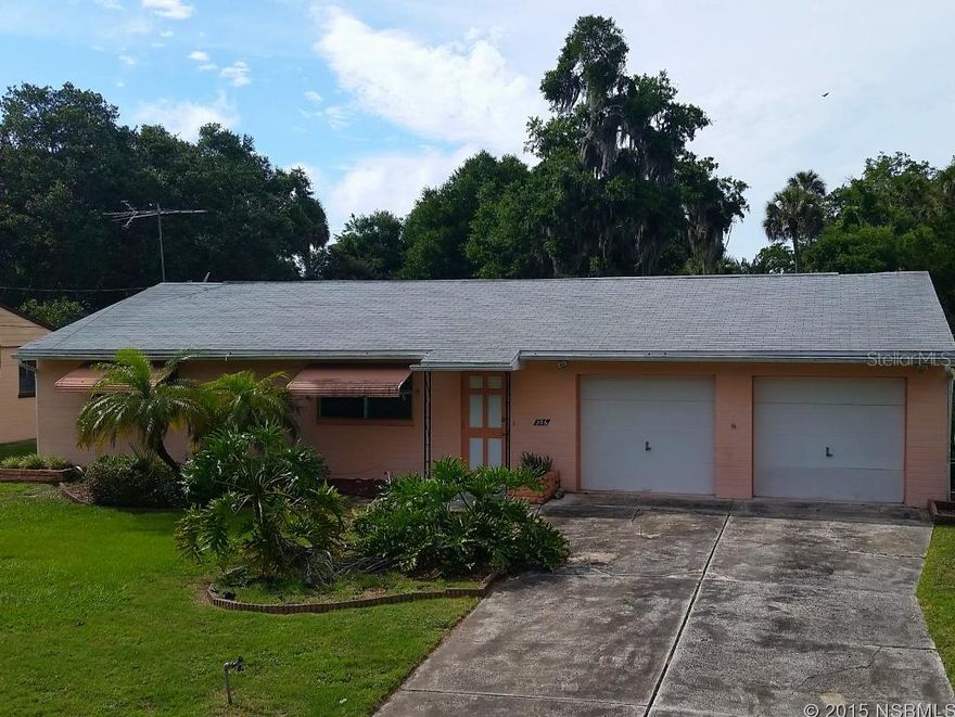 This is a fixer-upper with tons of potential. Situated on a 300' deep lot, there is plenty of room for a future pool, workshop, boat storage, detached garage in the super-sized backyard accessible by a double gated side yard. Home is 2/2, however there is a 3rd bathroom built into the 2-car garage. Original terrazzo floors are hidden beneath carpet and vinyl just waiting to shine again! Light and bright Florida room opens up to an expansive backyard deck/patio. Backyard is fenced. Located about a mile and a half from Canal Street, 3.5 miles to the beach and 10 minutes to the shopping of Port Orange. Offered AS-IS. All information thought to be reliable, but is not guaranteed to be accurate; you are advised to verify facts that are important to you. ;Water: City