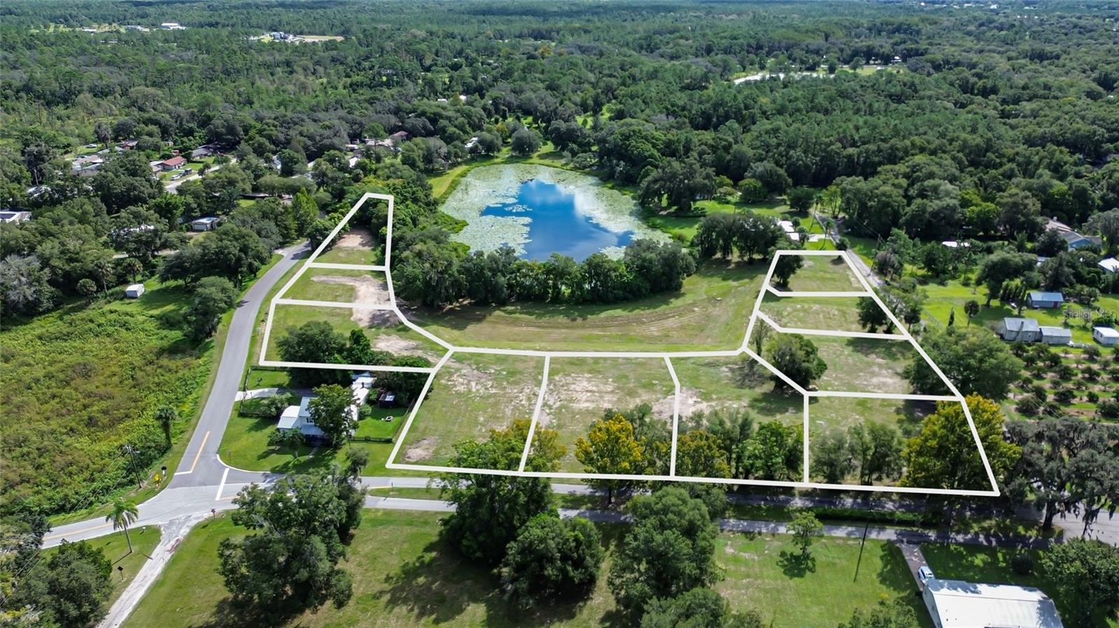 Discover an exceptional development opportunity in the heart of Lake Helen, FL! This 6.86-acre parcel is entitled and development-ready, offering 10 buildable lots—each with paved road frontage and convenient access to utilities for easy hookup. The property features beautiful water-view homesites overlooking a private 4-acre pond, creating a serene and picturesque setting for future homeowners. With oversized lot sizes ranging from approximately 0.28 to 0.50 acres, there’s ample space for custom home designs, gardens, and outdoor living areas. The land is cleared and ready to build, saving time and cost for developers or builders. Nestled in a peaceful rural-residential community, this location provides the best of both worlds—quiet country living with quick access to major transit routes leading to Orlando, area beaches, shopping, and dining. Whether you’re a builder seeking your next project or an investor looking for a turnkey development site, this Lake Helen property is a rare find with endless potential.
Flexible purchase options available—different lot groupings may be sold separately at reduced pricing