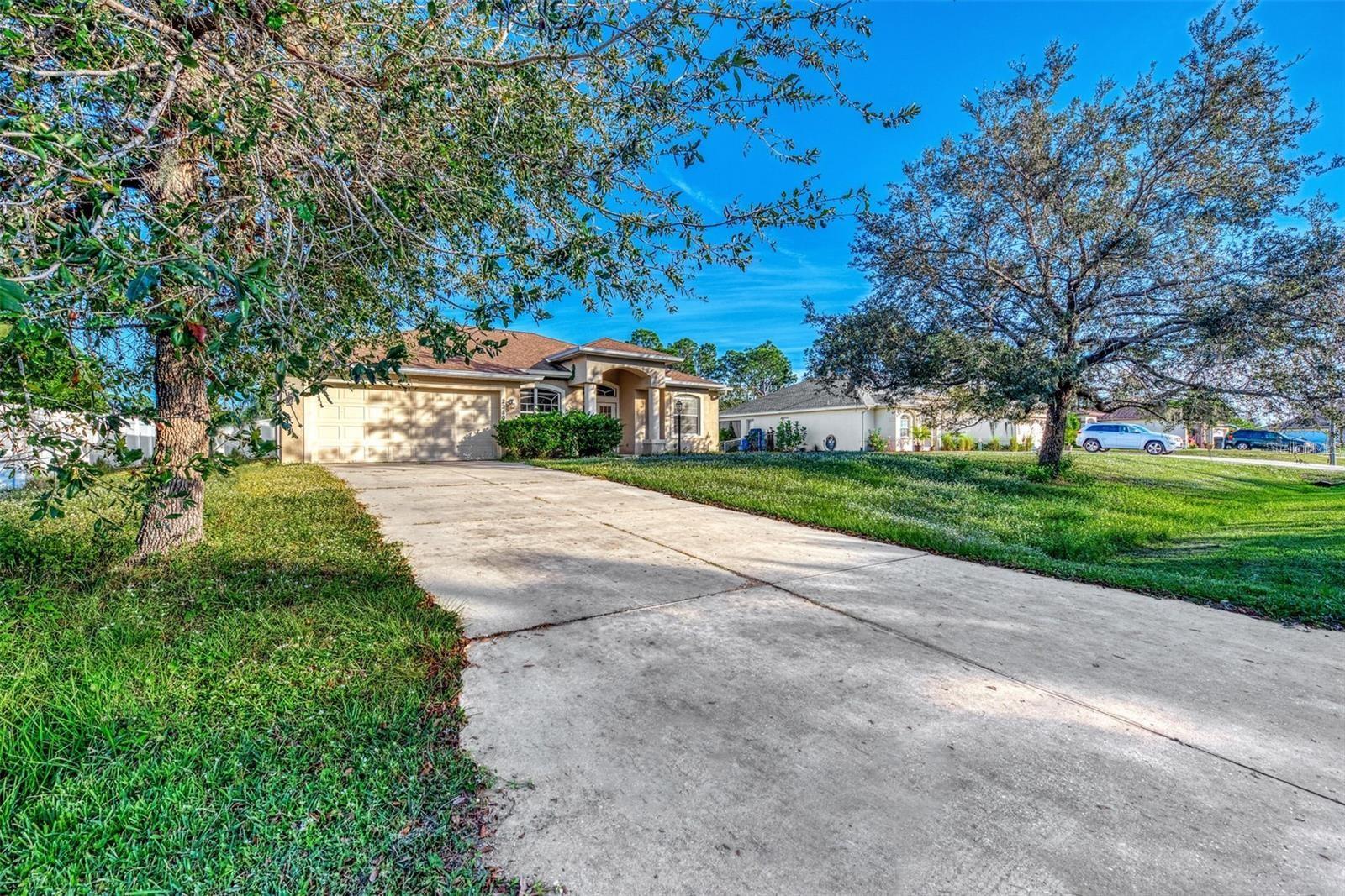 Welcome to your new home! This beautiful 3-bedroom, 2-bathroom home in North Port offers the perfect blend of comfort and functionality. The spacious split floor plan is ideal for entertaining, featuring an open living and dining area filled with natural light. The chef’s kitchen boasts ample cabinet and counter space and opens to a second living or dining area for added versatility. The primary suite includes tray ceilings, room for a king-size bed, two walk-in closets, and a luxurious en-suite bathroom with dual vanities, a soaking tub, and a walk-in shower. Two additional large bedrooms and a second full bathroom with a tub/shower combo are located near the kitchen, with the bathroom also offering access to a screened-in lanai, absolutely perfect for relaxing in privacy. A convenient laundry area is located inside, just off the attached 2-car garage. Situated close to shopping, dining, and I-75, this home is a fantastic opportunity you don’t want to miss. Schedule your private showing today!