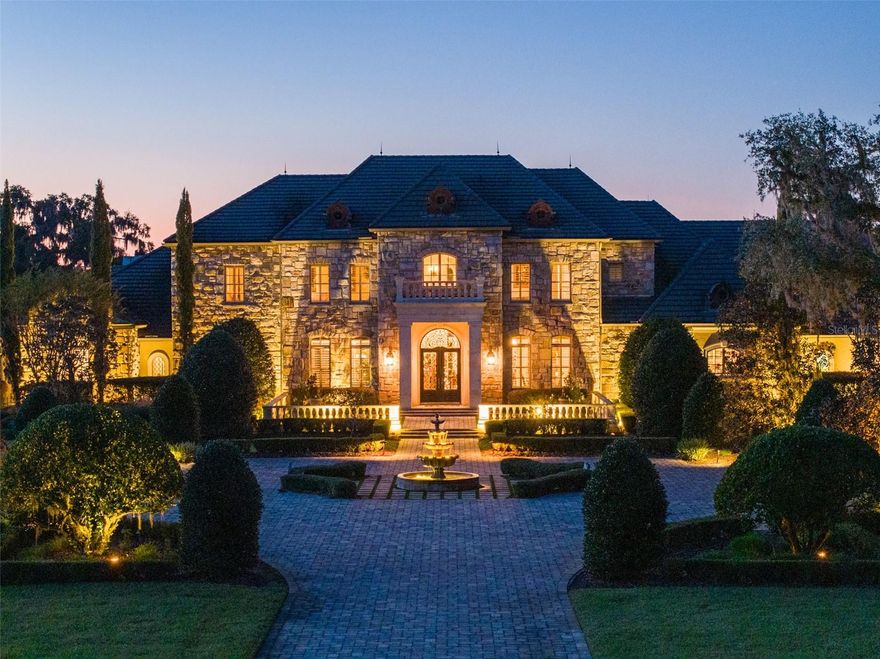 10 +/- Acre Incredible French Country Estate offers peace, privacy, and the enjoyment of having your own private estate. Magnificent, professionally designed, and sculpted 7,918 +/- SF 5-bedroom, 5.5 bath stone residence combines the best of elegance, style, and craftsmanship and offers gorgeous, expansive views of the surrounding Granddaddy Oaks and grounds. The foyer opens to a grand staircase, formal dining, and a large living room with a carved stone fireplace. Beautiful chef’s kitchen with hidden pantry, butler’s pantry, expansive center island, the bar seats five, and a separate family room with fireplace and family dining area. The open floor plan makes the home perfect for entertaining friends and family. French doors open onto expansive verandas with a summer kitchen, outdoor dining, and gathering areas around a double-sided fireplace overlooking an exquisite pool. Spacious owner’s suite offers a seating area, dual closets, and access to the pool. The incredible features that make this French home elegant and warm include Travertine floors, soaring architectural ceilings, impressive beam works, five fireplaces, and intricate moldings. Private office, exercise room, wine room, game room with beautiful beverage bar and seating area for watching games, planning your next duck, deer, or turkey hunt. This resort-like property is unsurpassed. 4- Car garage. Located just minutes from Williston airport.  Additional adjoining acreage is also available.