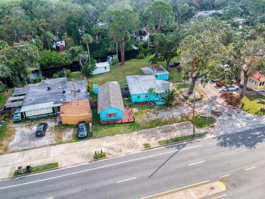 Situated on a large irregular corner lot directly on the canal, this unique property features 3 structures ideal for a multitude of uses. Currently set up as a retail store with recent updates including brand new ADA restroom newer AC and roof, a detached garage ideal for storage and the 3rd building is a bright and cheerful single family home that has been renewed with newer floors, roof, water heater and windows giving you the option to run your business and live on site if you wish. Zoned  Ridgewood Development means there are a multitude of allowable uses and featuring over 70ft of frontage on busy Ridgewood Ave., these buildings offer a ton of possibilities and opportunity in flourishing Port Orange. ;Water: City