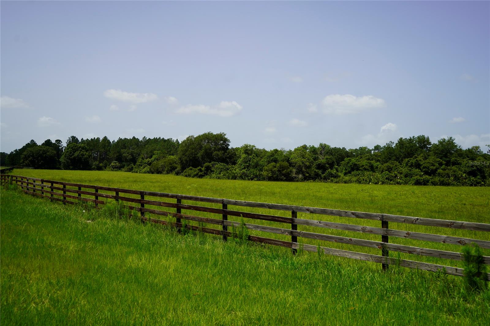 GATED COMMUNITY vacant lot! This beautiful partially wooded 5.3 acre lot is ready for your dream home. Located in a new quiet neighborhood, approximately 200 acres, and close to town, beaches, airports, but far enough to feel secluded. You can ride your horse around this community or ride less than 1 mile to an 8,000 acre preserve, known as Deep Creek Preserve. This unique preserve limits access to non-motorized vehicles, horses, and foot traffic ONLY. You don't have to have horses to appreciate this country community. Enjoy the nearby Lake Ashby Park that is less than 1 mile from this lot, which has a boat ramp, fishing pier, playground, picnic area, and tent camping facilities. Utilities are available in the area. The lot will need a well and septic system. Survey required for exact lot dimensions. Contractor on site in the community.; Cleared: Partial