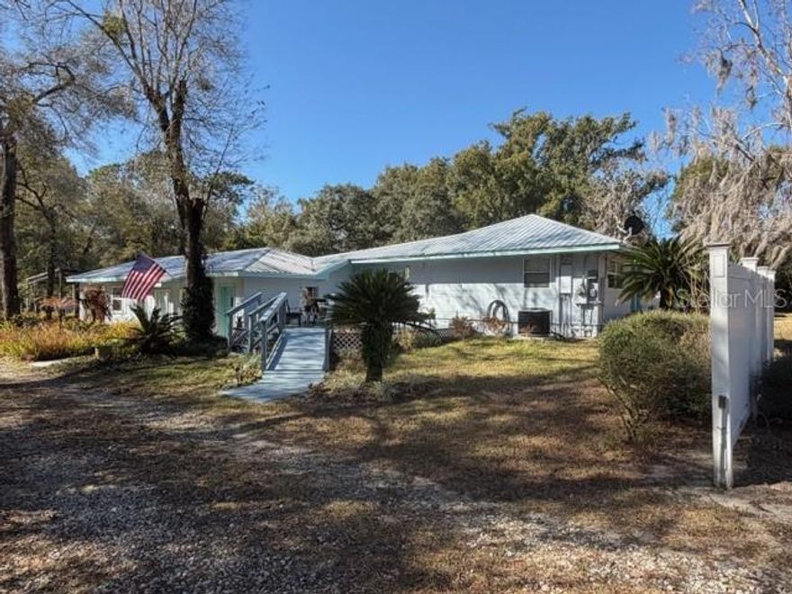 Private 6.07 Acres of Pristine Wooded Property with a huge 48 x 40 1,920sf Shop Building with 16' ceilings and full bath room, a 44 x 38 1,760sf RV and Boat Pavilion Carport for a Class A RV and a 42' boat, 24 x 20 ADU In Law Building with Private Entrance, 3 other small Outbuildings, Fenced Pasture, Beautiful 2 Bedroom 2 1/2 Bath home with Private Office, Well Appointed, Spacious with an Open Floor Plan with the Kitchen, Breakfast Room and Family Room all open, 2 Primary Suite Bed Rooms, Inside Laundry Room, 1 Car attached Garage, No HOA, County maintained Road, Great Proximity to the 429 Wekiva Parkway leading to I-4 and the 417 Expressway, a Truly Beautiful Home in the country with convenience to shopping, restaurants, Mount Dora, and Sanford.