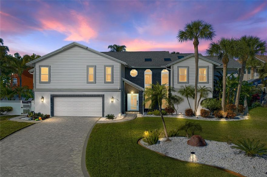 Welcome to one of Tierra Verde’s best-kept secrets. Perfectly positioned on a quiet cul-de-sac, this beautifully updated residence captures breathtaking, unobstructed views of the Pass-A-Grille Channel and the Gulf, offering the scenery and serenity of waterfront living without the expense or maintenance of a seawall. Enjoy the view, the breeze, and the lifestyle without the typical waterfront headaches or price tag.

Soaring vaulted tongue-and-groove ceilings and expansive windows flood the home with natural light and frame sweeping water vistas from multiple rooms and levels. The open, airy layout celebrates its surroundings, with wrap-around decks creating seamless indoor-outdoor living and the perfect setting for morning coffee or sunset cocktails.

The spacious kitchen serves as the heart of the home with timeless white cabinetry, granite countertops, a coordinating wet bar, and breakfast bar overlooking the family room with a wood-burning fireplace. This central gathering space flows effortlessly to covered outdoor living areas and decks, making entertaining easy while keeping the water in sight.

The primary suite is a true retreat. Generously scaled and filled with natural light, it includes a versatile sitting area ideal for a lounge, reading nook, or home office. The newly completed luxury bath has been fully renovated with quality finishes, dual vanities, soaking tub, and separate shower. A custom walk-in closet larger than many secondary bedrooms provides exceptional storage and organization.

Spanning two levels with three+ bedrooms and three baths, the layout is ideal for multi-generational living, extended guests, or evolving needs. Each level offers privacy while remaining connected to the heart of the home.

Set on an oversized lot with mature tropical landscaping, the fenced backyard features a pebble tech pool and spa converted to a saltwater system for easier maintenance and skin-friendly swimming. New paver decking and generous entertaining areas create the perfect environment for hosting or relaxing, enhanced by sparkling water views. An artificial turf putting green adds a fun touch, while refreshed landscaping and hardscaping provide a polished, low-maintenance coastal aesthetic.

Extensively improved and meticulously maintained, this residence was purchased as a forever home and thoughtfully upgraded with long-term comfort in mind. Recent enhancements include hurricane-impact windows and doors, new paver driveway and walkways, updated lighting, fully renovated primary bath and custom closet, guest bath updates, new interior doors and hardware, updated staircase, Halo whole-house water filtration system, new attic insulation and ventilation, WiFi-enabled switches and outlets, new gutters, French drain system, exterior repainting, saltwater pool conversion with new equipment, refreshed irrigation, and numerous additional improvements that enhance efficiency and peace of mind.

With an oversized two-car garage, bonus storage and flex space, and a location just minutes from beaches, marinas, and dining, this exceptional property delivers panoramic water views, extensive upgrades, and versatile living. Experience coastal living with convenience, quality, and ease today’s buyers demand.