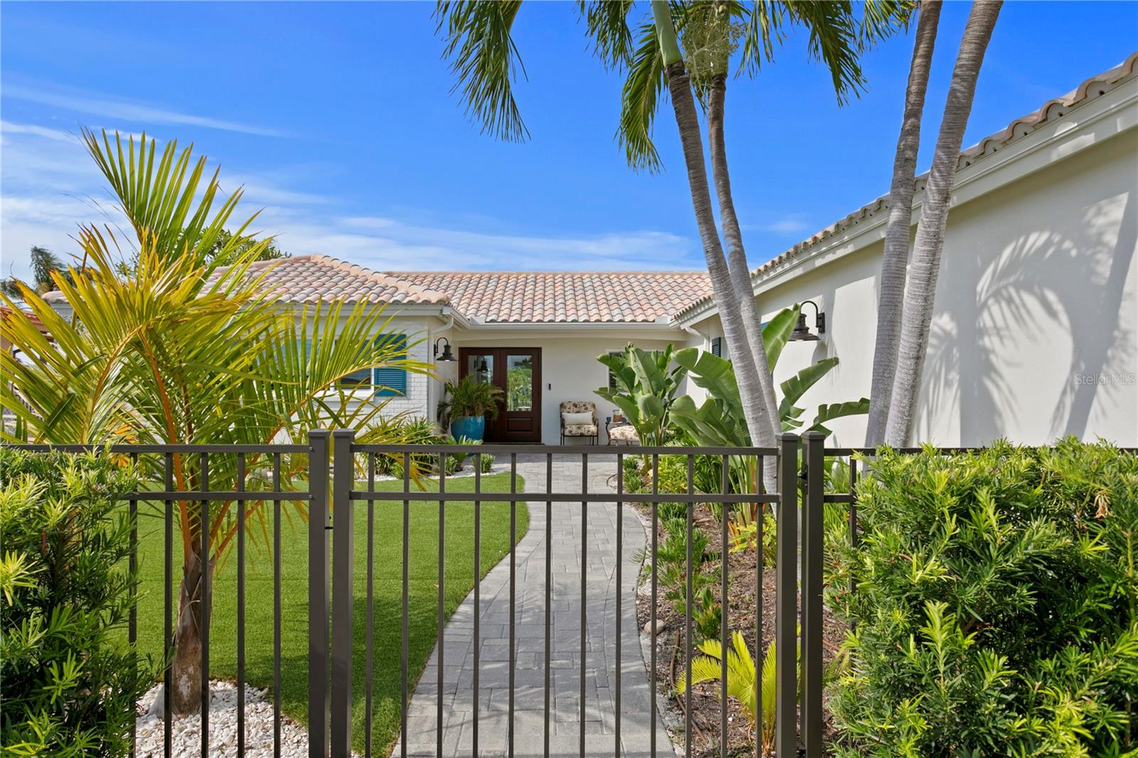 Welcome to the pinnacle of waterfront living on coveted Vina Del Mar Island—where luxury, location, and elevation converge in perfect harmony. Perched on one of the island’s most desirable streets with sweeping views of the iconic Don Cesar, this completely reimagined 3-bedroom, 2.5-bath home is the definition of refined coastal living. From seamless tile flooring throughout to impact-rated windows and doors, every inch has been crafted with elevated finishes and attention to detail. If entertaining an intimate dinner party or the next family reunion, this home has the open space, plenty of guest parking and is absolutely ready for all the memory making to happen! The home boasts a spacious primary ensuite with walk-in closet and access to the pool/spa, 2nd ensuite with walk in closet and a 3rd bedroom currently used as a office/den, brand-new plumbing and electrical system were completed during the 2023 full renovation that encompassed the entire property from curb to waterfront.
Step outside to your private tropical retreat featuring a heated pool with spillover spa, generous outdoor living space, and a brand-new dock with a 24K boat lift—perfect for quick access to the Gulf. With high finished floor elevation and true first-floor living, this home offers a rare advantage found nowhere else on the barrier islands.
Historic Pass-a-Grille invites you into a world of charm with boutique shops, waterfront restaurants happy to cook your fresh catch, and a warm, welcoming vibe. This is a golf cart-friendly community, where the white sandy beaches and Gulf inlet are always just moments away.
Location, Location…Elevation. This is your once-in-a-lifetime opportunity to own the most enviable slice of waterfront paradise on Vina Del Mar Island. Easy access to trendy downtown St Petersburg to enjoy trendy restaurants, world renowned museums or to catch a Rowdies/Rays game. Only 30 mins to Tampa Int'l Airport makes business or casual travel a breeze!