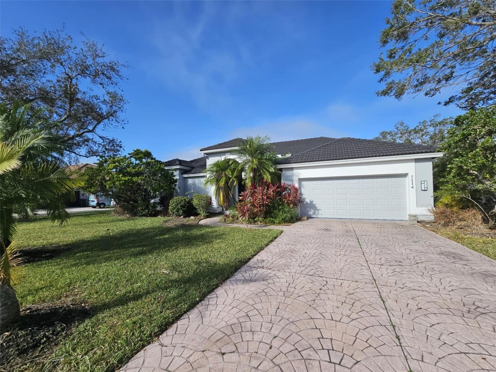 Stunning contemporary executive home available for annual rental. Nearly 2,500 square and 3 bedrooms, 3 baths and 2 car garage. Enormous corner lot, water view, outdoor kitchen, pool and spa in the River Club subdivision. 12 foot ceilings, plenty of windows and natural light. Sliders give access to pool area which is screened in and has direct access to a pool bath. Beautifully updated kitchen, plenty of cabinetry, custom built-ins, and many designer touches and accents. This is a beautiful home just 2 minutes from the River Club golf course. Lawn and Pool maintenance included. Access to interstates, Lakewood ranch and everything else you need. First, Last, and security. Tenant must also obtain approval from River Club association. Application 75$ per adult. Available Sept.