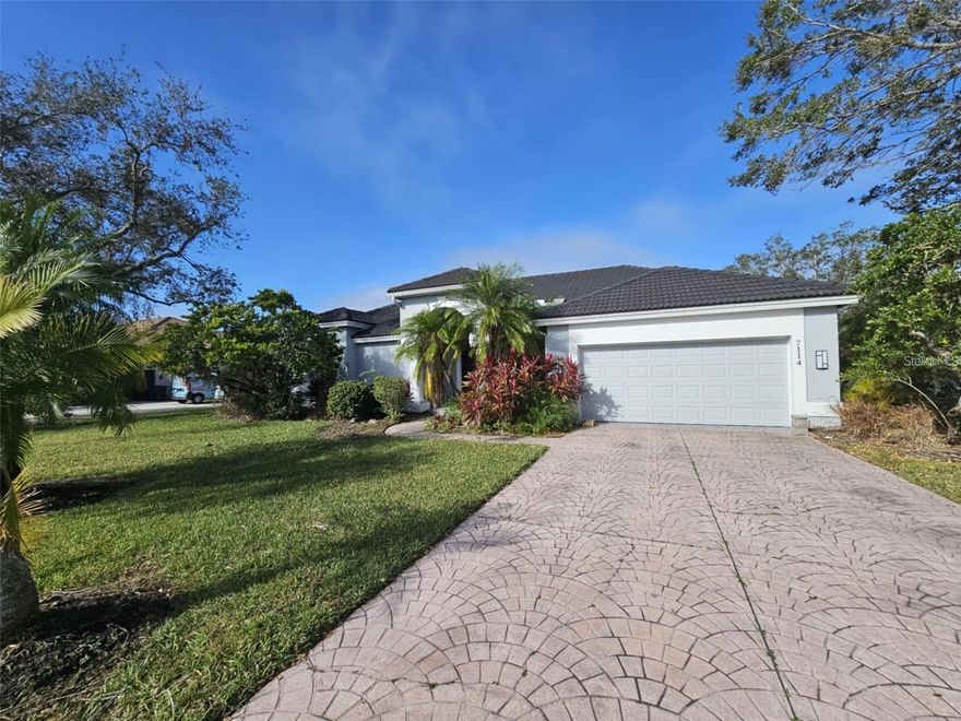 Stunning contemporary executive home available for annual rental. Nearly 2,500 square and 3 bedrooms, 3 baths and 2 car garage. Enormous corner lot, water view, outdoor kitchen, pool and spa in the River Club subdivision. 12 foot ceilings, plenty of windows and natural light. Sliders give access to pool area which is screened in and has direct access to a pool bath. Beautifully updated kitchen, plenty of cabinetry, custom built-ins, and many designer touches and accents. This is a beautiful home just 2 minutes from the River Club golf course. Lawn and Pool maintenance included. Access to interstates, Lakewood ranch and everything else you need. First, Last, and security. Tenant must also obtain approval from River Club association. Application 75$ per adult. Available Sept.