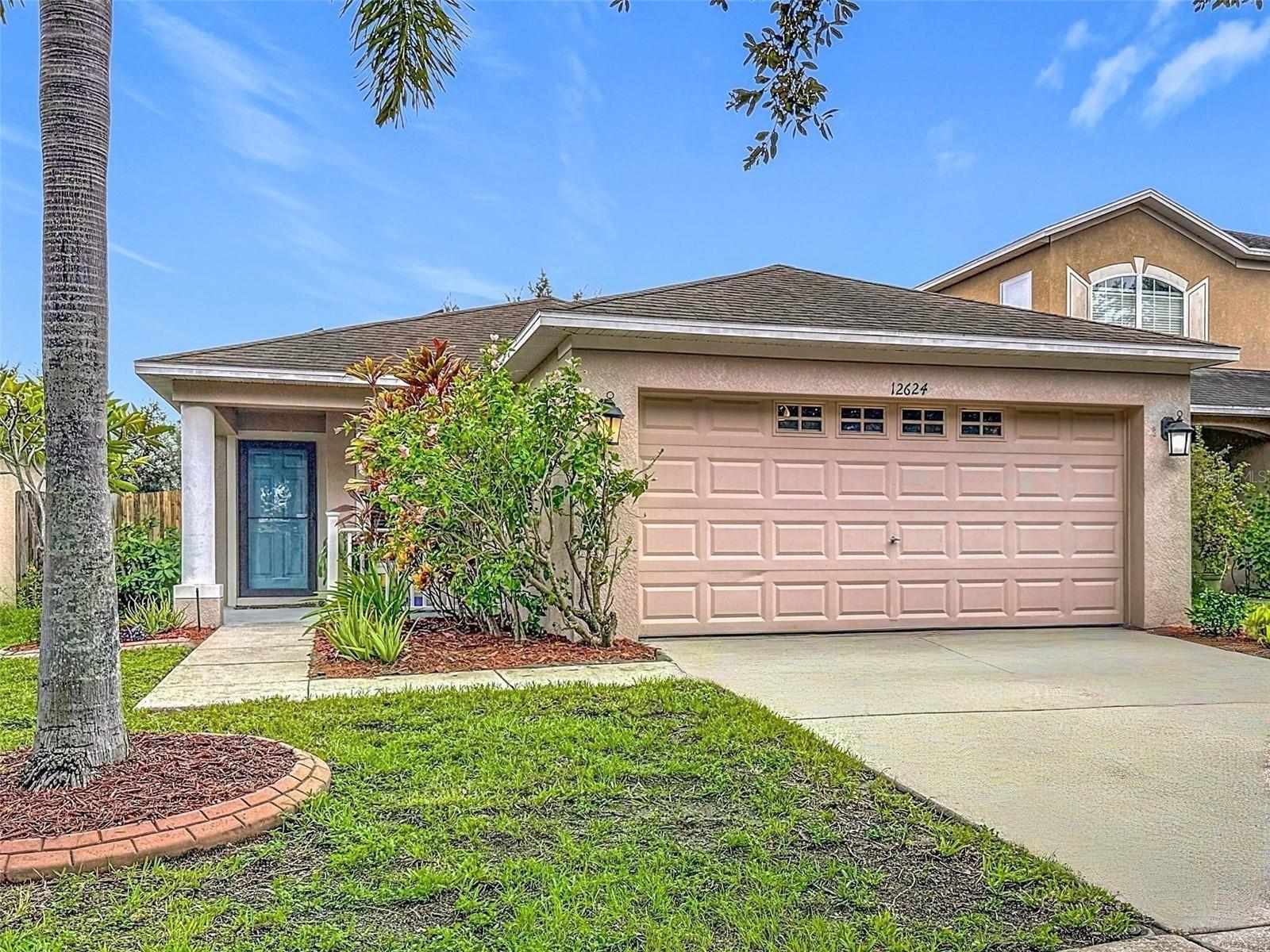 Energy-Certified, 3 Bed/2 Bath plus Bonus/Flex Room home located in the desirable Panther Trace community of Riverview. This home features fully paid-off solar panels, a smart thermostat, HVAC UV light filtration, tinted windows, newer water softener, and a new water heater to help keep your home running efficiently and your monthly bills low. Smart Home capabilities- programmable AC, door locks, smart switches and bulbs (optional to use) throughout home. The open layout offers a spacious living room and dining area with Modern wood-look tile running throughout the home- NO Carpet for easy maintenance and a clean, updated feel. Step outside to a private backyard oasis with lush landscaping and an abundance of fruit trees including plums, grapes, avocados, limes, guava, and figs. The front yard also offers great curb appeal with mature trees and well-kept landscaping. Panther Trace is one of Riverview’s most sought-after communities, offering Resort-style amenities such as two lagoon-style pools, a splash pad, playgrounds, tennis and pickleball courts, basketball, a clubhouse, parks, and scenic walking paths. With a very low HOA of only $65/year, top-rated schools, and convenient access to I-75, Tampa, beaches, shopping, dining, and hospitals, this home is the perfect blend of style, efficiency, and location.
