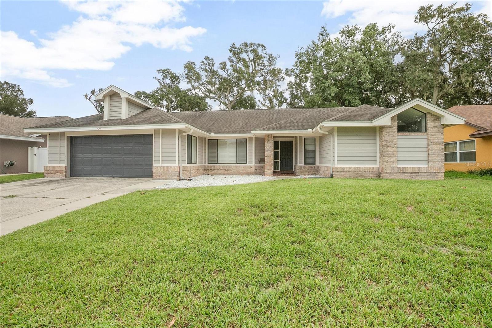 Welcome to 679 N Endeavour Drive — a beautifully remodeled single-story home nestled in the desirable Oak Forest subdivision of Winter Springs. This 4 bedroom, 3 full bathroom gem blends modern updates with comfortable Florida living.
Interior Highlights:
• Approx. 2,066 sq ft of living space, thoughtfully laid out with vaulted ceilings and abundant natural light.
• Ceramic tile flooring throughout for ease of maintenance.
• Skylight enhances the bright, open feel.
• Recent kitchen remodel: granite countertops, soft-close cabinets & drawers, breakfast bar built to seat six.
• Versatile bonus space: garage has been converted into a separate bedroom/bathroom with exterior access — ideal for guest suite, gym, or craft room. Storage/workshop area included.
Exterior & Lot:
• Lot size approx. 0.27 acres (˜ 80 × 150 ft), with beautifully landscaped grounds.
• Private outdoor entertaining space featuring a sparkling above-ground pool with deck.
• Storage shed with power.
Additional Features:
• Block & stucco construction; shingle roof.
• Central air conditioning & electric heating.
• No HOA — gain more flexibility and fewer restrictions.
Location & Amenities:
• Located in sought-after Seminole County with top-rated schools: Keeth Elementary, Indian Trails Middle, Winter Springs High.
• Convenient to shopping, dining, parks, major roadways for easy commuting.
Price & Status:
• Offered at $529,900
• Move-in ready — don’t miss this rare opportunity in Oak Forest to enjoy stylish living with space indoors and out