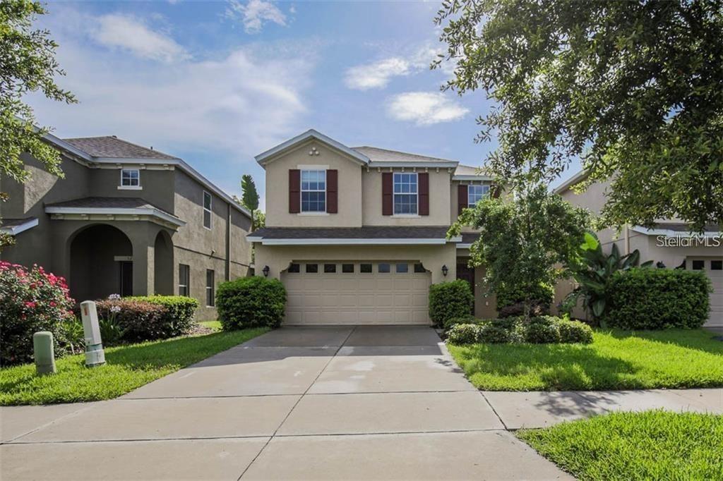 Beautiful home has 3 large bedrooms, 2 full baths, 1 half bath, 2 car garage and no backyard neighbors! Open-concept living area features a modern kitchen with 42" cabinets, stainless steel appliances, granite countertops and modern lighting. All tile floors downstairs with sliders that exhibit a beautiful view of the huge back yard. Upstairs you will find a spacious suite to include the large primary bedroom, gorgeous primary bath with a granite dual sink vanity, glass shower enclosure, garden tub, and huge walk-in closet. There are 2 additional bedrooms and a second full bath upstairs, along with a spacious loft area that makes the perfect living area or open-air office. The laundry room is located upstairs for convenience. The screened and pavered lanai complete with hot tub looks out to the spacious yard on a conservation lot. An outdoor attached utility closet is perfect for extra storage. This home is assigned to the fantastic A rated FishHawk schools and to top it all off it's just a short walk to the beautiful Starling Club - with it's gym, climate controlled pool, splash pad and game room. Rental of this property conveys access to all of FishHawk's spectacular amenities and A rated schools. LAWN CARE INCLUDED. Landlord will consider rent with option to buy as well.