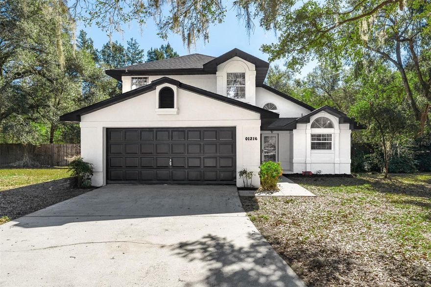 Welcome to this breathtaking home on a private, fenced in, 1-acre cul-de-sac lot with NO HOA, a two-story screened pool enclosure, a large pool, and a large, covered outdoor seating area, located in peaceful Linda Glen Estates. 

Inside, the home is fresh and modern with brand-new light oak LVP flooring, fresh interior paint (Sherwin Williams Shoji White) as well as exterior paint, and vaulted ceilings that let in natural light. The late afternoon sun just pours in through the French doors leading out to the pool area, casting a beautiful glow. The focal point of the living area is a dramatic two-story brick fireplace. The kitchen features new wood cabinetry, quartz countertops, a farmhouse sink, and new stainless steel appliances. The primary bedroom is located on the first floor, while the second floor offers two guest bedrooms and a loft area, great for a home office or an additional den area. One guest bedroom has a window seat with storage, a cozy nook looking out over the driveway area and cul-de-sac. Smart home features include lights, Ring doorbell and thermostat that are controlled through WiFi/Alexa for security and convenience. All 2. 5 bathrooms have been remodeled, including the convenient guest half bath downstairs. The ROOF, WELL tank and WATER HEATER are brand new. Most of the property is fenced with a wooden fence, with additional land beyond the fenced area and mature oak trees that add privacy and character. 

The backyard offers plenty of space to park a boat or RV. Although the community is not governed by an HOA, the neighborhood is tidy and well kept, reflecting pride of ownership. 

Enjoy a peaceful setting with no visible homes behind the property and only one neighboring home to the side. Conveniently located approximately 1 hour to Orlando, about 1 hour to Disney, and just down the road from The Villages.