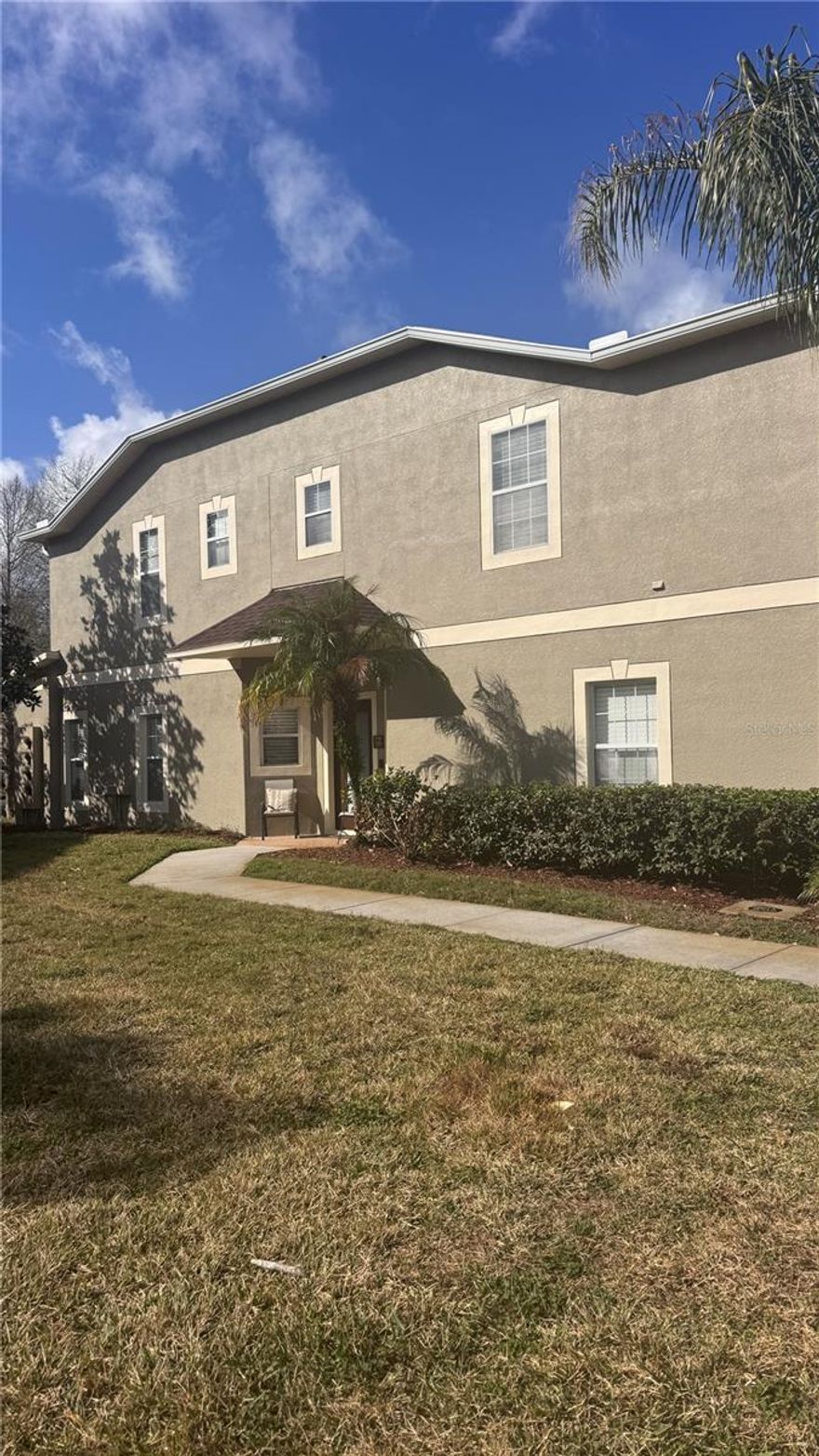 Upgrades?  Everywhere!  Extra parking?  Multiple places!!  Peaceful water view?  All day long!  Huge living space?  Obviously!!  FOUR bedrooms?  Yep!!  THREE bathrooms?  Yes, yes and yes!  Gated community?  Of course!  Add to this is an end unit with lots of windows and light and you have the PERFECT home with a convenient location, close to shopping, restaurants and highways.  Large side yard provides huge space for furry family members and the cul-de-sac location is perfect for outdoor play.  Stunning back yard with wide water view, trees beyond and screened lanai where you can watch beautiful sunsets every evening to calm the soul.  FIRST FLOOR BEDROOM AND BATH WITH THREE OTHER BEDROOMS UPSTAIRS AND TWO BATHS!  Water heater replaced in 2023.  A/C replaced in 2023.  HOA takes care of the roof that was replaced in 2023 also.  NEW dishwasher, NEW refrigerator, NEW microwave, NEW sink.  NEW granite in the bathrooms, NEW backsplash in kitchen, NEW kitchen cabinet doors and crown molding. NEW blinds, NEW medicine cabinet and NEW lanai pavers.  NEW ceiling fans in the bedrooms and barn doors on the upstairs laundry room.  WASHER AND DRYER STAY!   HOA fee covers WATER, TRASH and LANDSCAPING.  Located just south of SR56 so access to I75, Wiregrass Mall and the outlet mall and so many restaurants are just minutes away.  Easy access to multiple hospitals and entertainment.  Located in the back of the community so minimal cars, more open spaces and lots of parking.  This truly one of a kind home is a must see.  Easy to show!  Professional photos to be added soon.