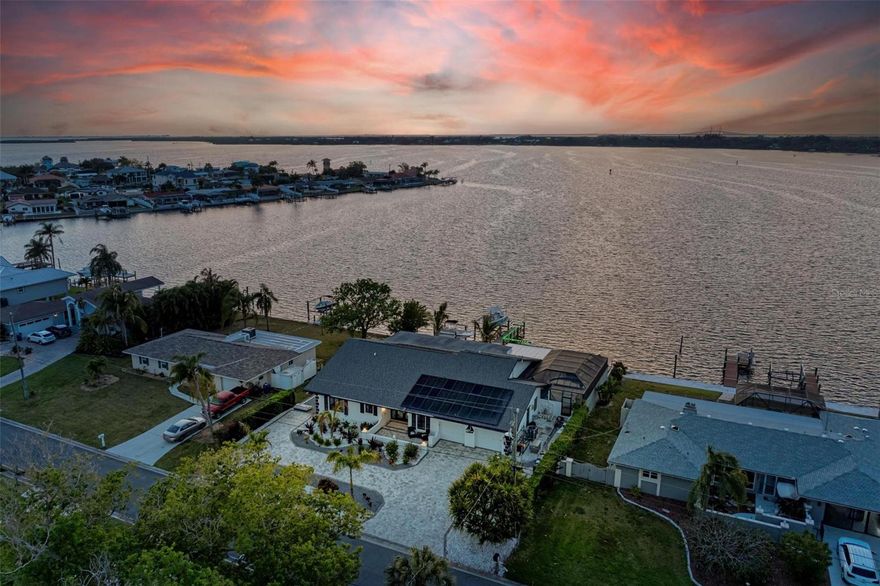 Welcome to the Most Commanding West-Facing Deepwater Position on Terra Ceia Bay…Offering 100 Feet of Unobstructed Open Water Frontage in a Highly Desired Boating Community with No CDD and No HOA…Spanning 3,645 Sq Ft, this Waterfront Residence Is Intentionally Oriented so the Florida Room, Pool, Lanai, Primary Suite and Grounds Converge Seamlessly Toward Expansive Horizon Views and Daily Sunsets…Designed for Effortless Entertaining and Structured for Enduring Coastal Living…The Kitchen Anchors the Living Areas with Solid Wood Cabinetry, Granite Countertops, Wine Refrigerator, Generous Pantry Storage and Direct Transition to Covered Outdoor Dining…The Primary Suite Opens to the Water-Facing Florida Room and Features a Spacious Walk-In Closet and Custom Marble Walk-In Shower with Multiple Shower Heads and Dual Vanities…The Private Dock Is Equipped with Two Heavy-Duty Lifts Rated at 30,000 and 60,000 Pounds…Sailboat-Friendly Water, Concrete Seawall and Evening Dock Lighting Enhance Both Capability and Experience…Immediate Access to Open Water with Fueling Stations, Marine Services, Waterfront Dining and Barrier Islands Within Easy Reach by Boat…Saltwater Pool Resurfaced with Pebble Tec…Secondary Baths Beautifully Remodeled…New Roof 2025…8-Foot Interior Doors…Xeriscaped Grounds for Reduced Maintenance…Circular Paver Driveway with Side Boat Storage…Convenient Access to I-75 Connecting to St Petersburg, Tampa International Airport, Sarasota, UTC and Siesta Key Beach…A Definitive Waterfront Holding Defined by Position, Infrastructure and Open Bay Exposure…Private Tours Available by Appointment…Live a Fuller Life!